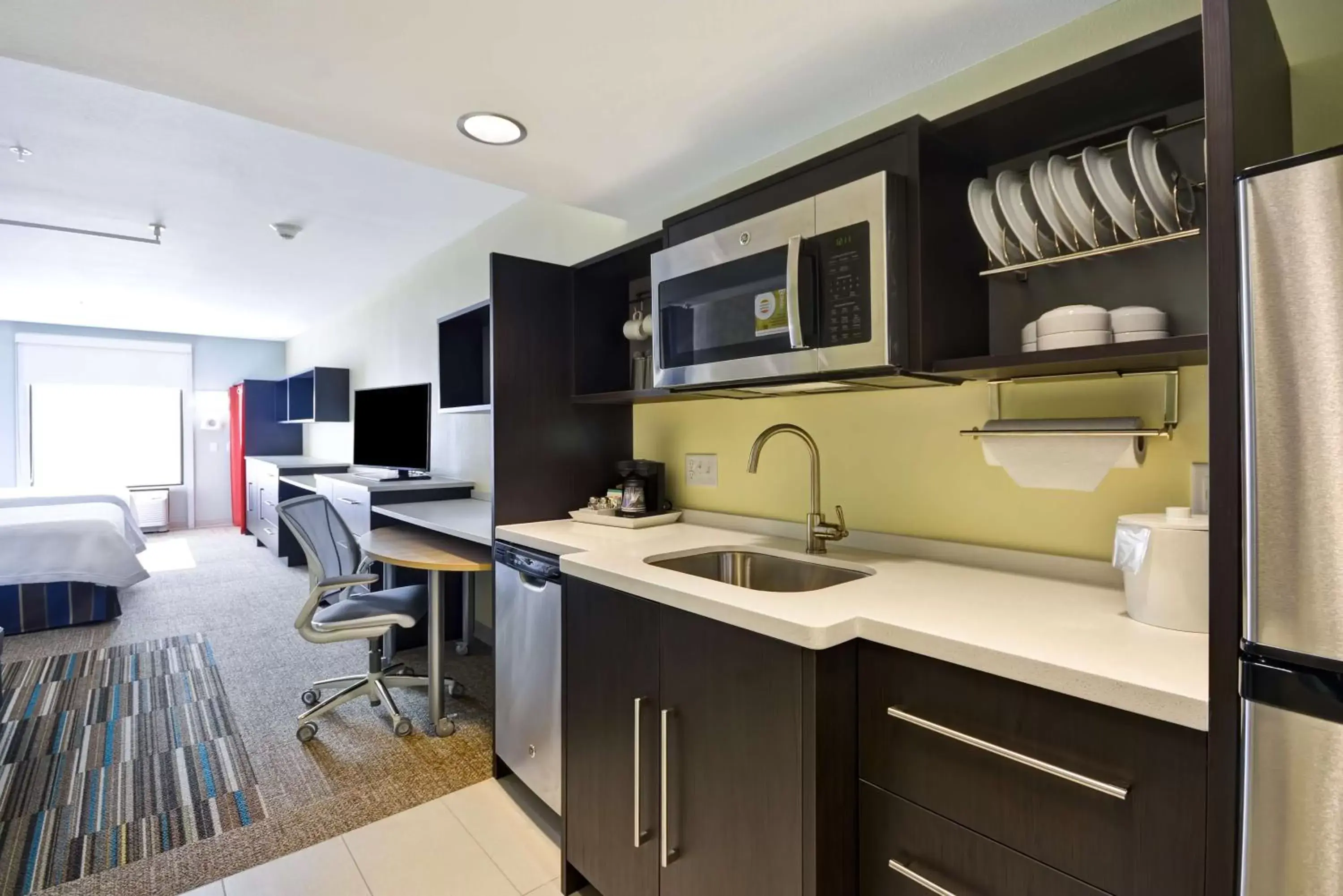Bedroom, Kitchen/Kitchenette in Home2 Suites By Hilton Oswego
