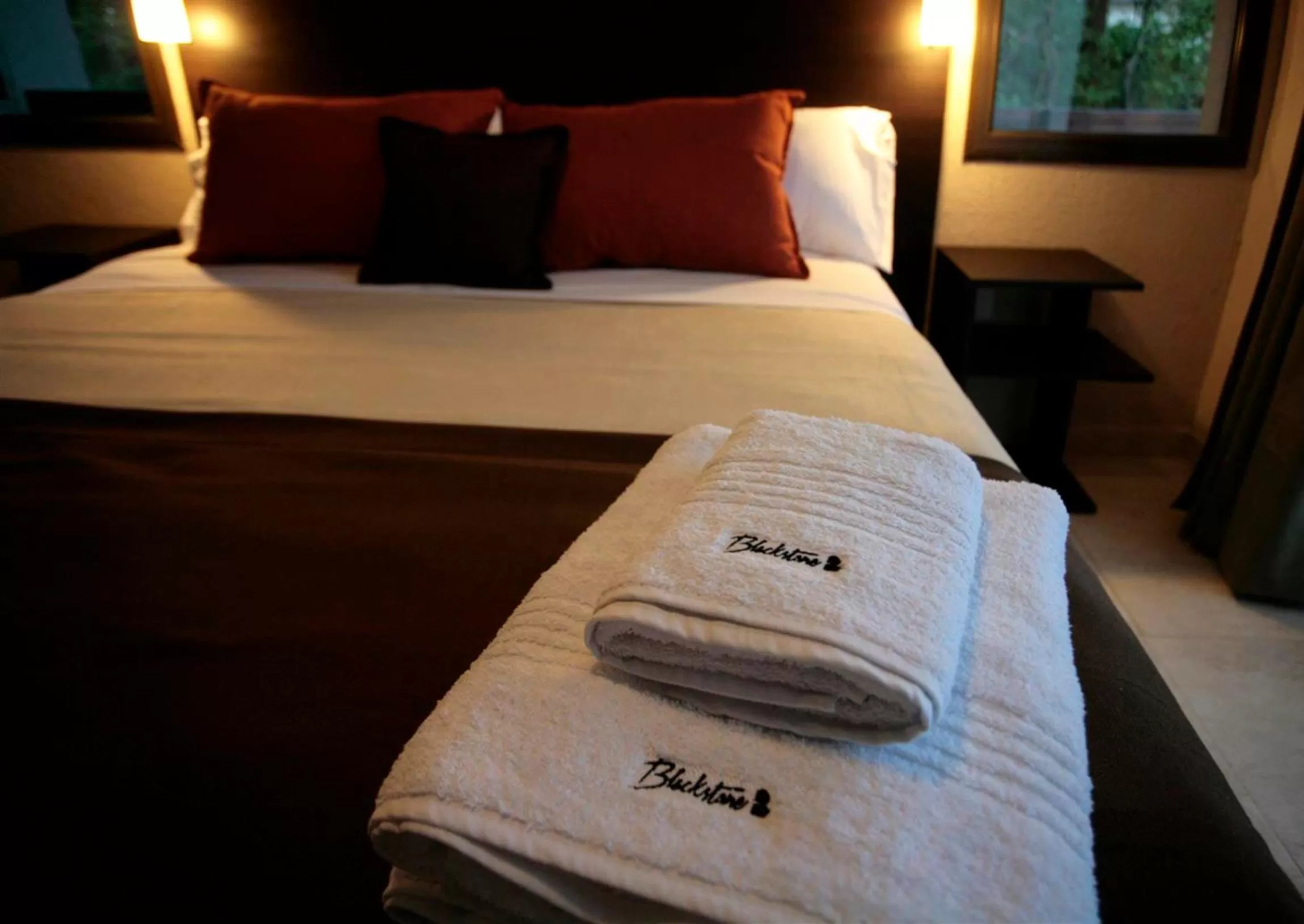 Bed in BlackStone Apart Boutique Hotel