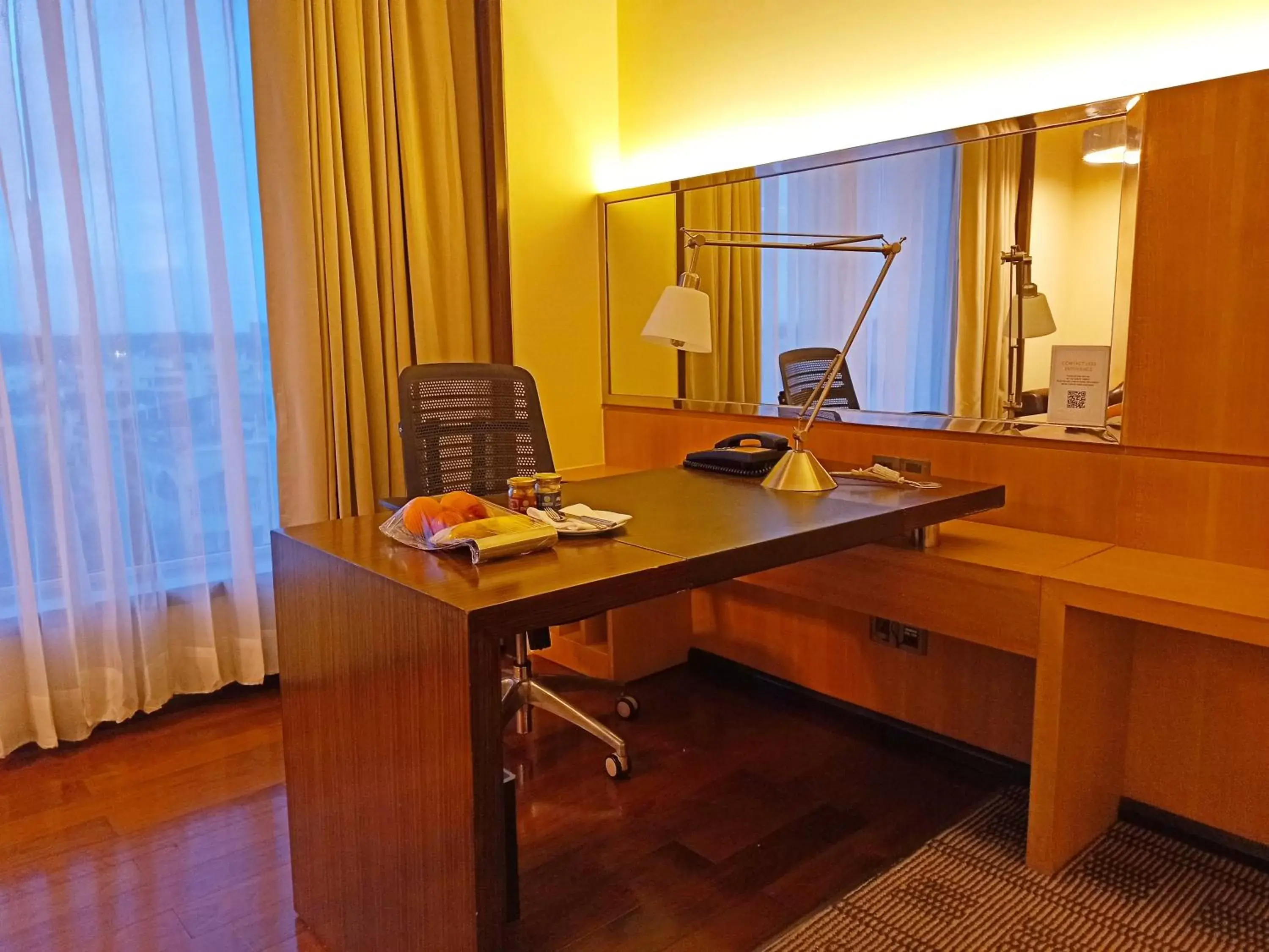 Seating area, TV/Entertainment Center in Courtyard by Marriott Bilaspur