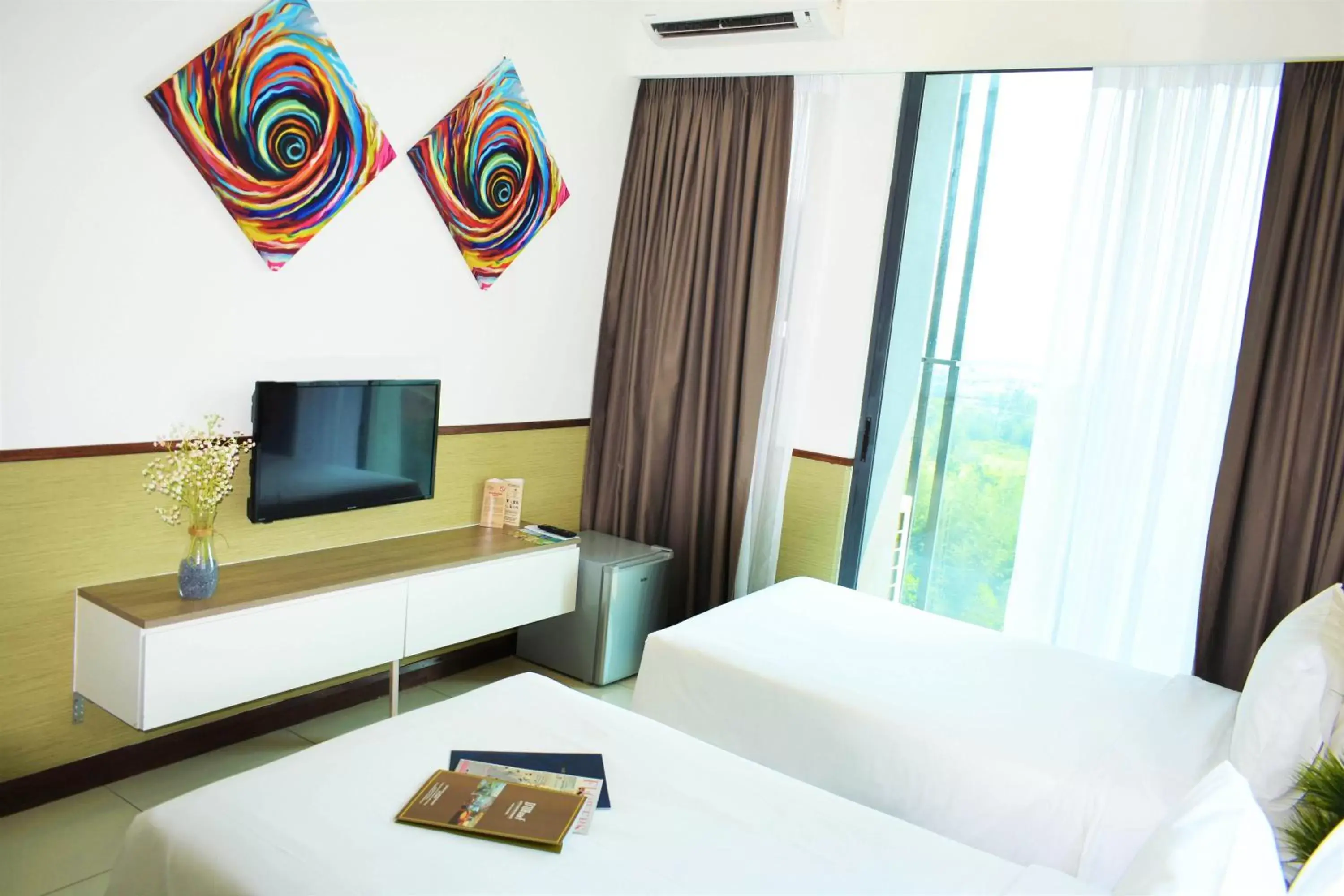 Photo of the whole room, TV/Entertainment Center in D'Wharf Hotel & Serviced Residence