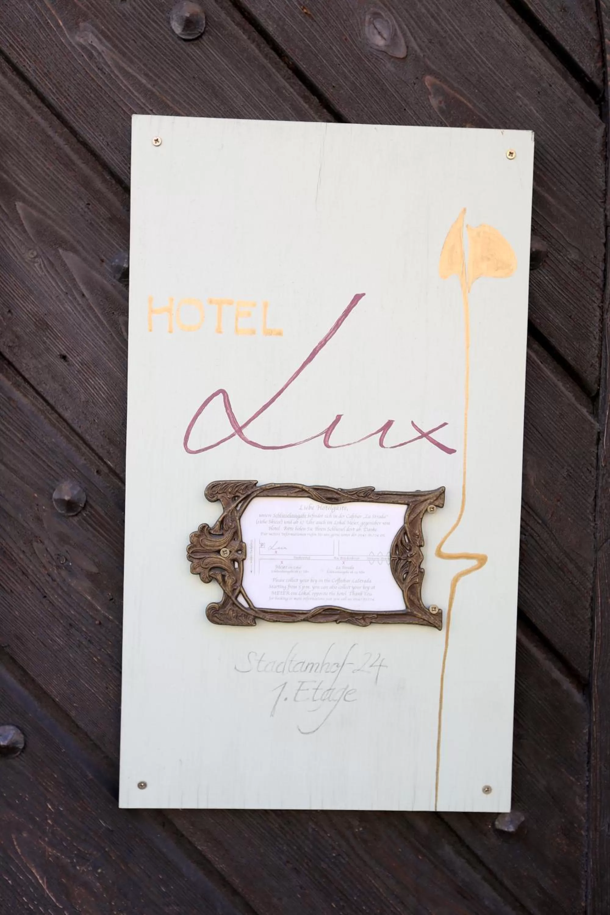 Property logo or sign in Hotel Lux