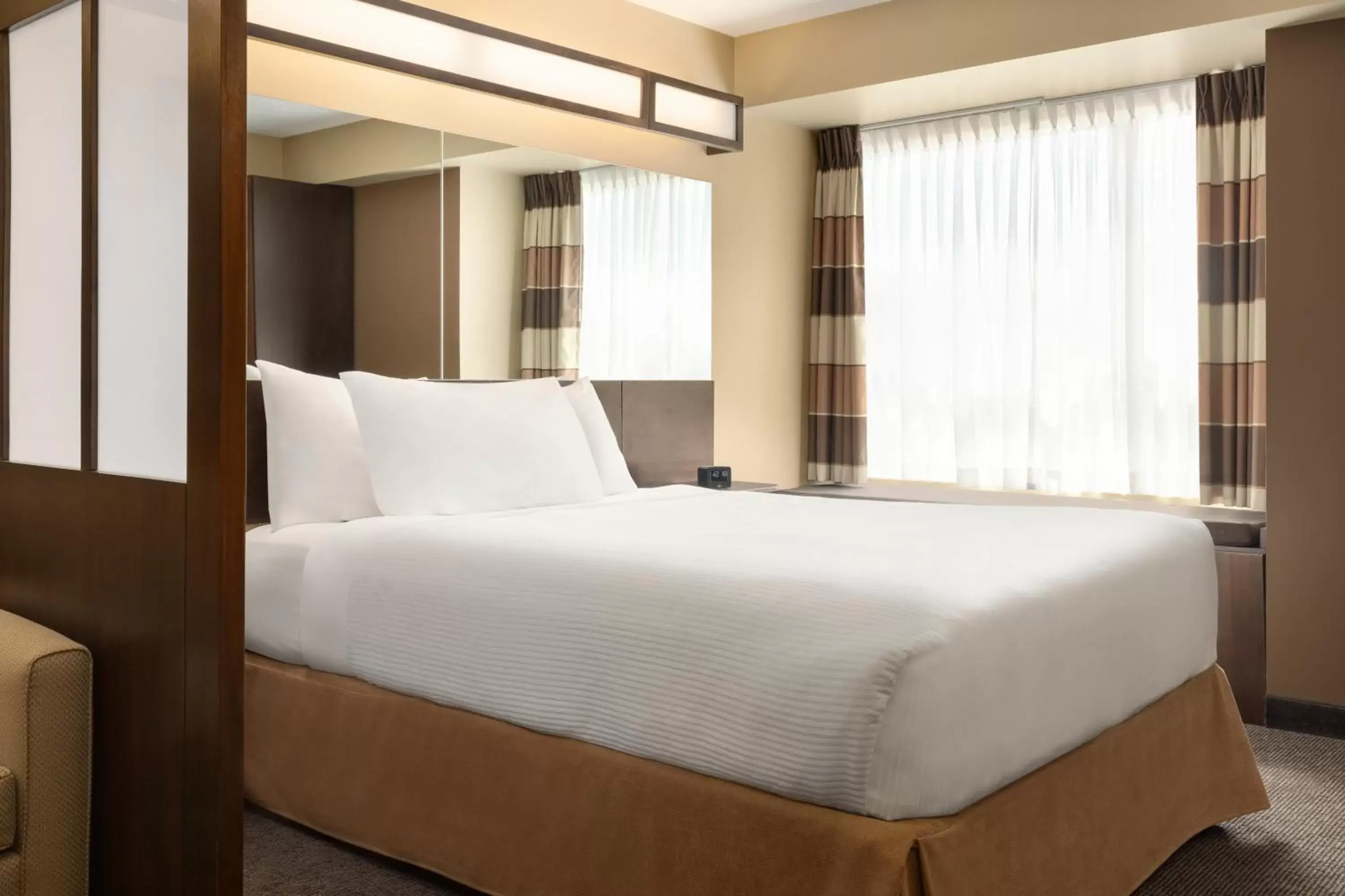 Bed in Microtel Inn and Suites by Wyndham Weyburn