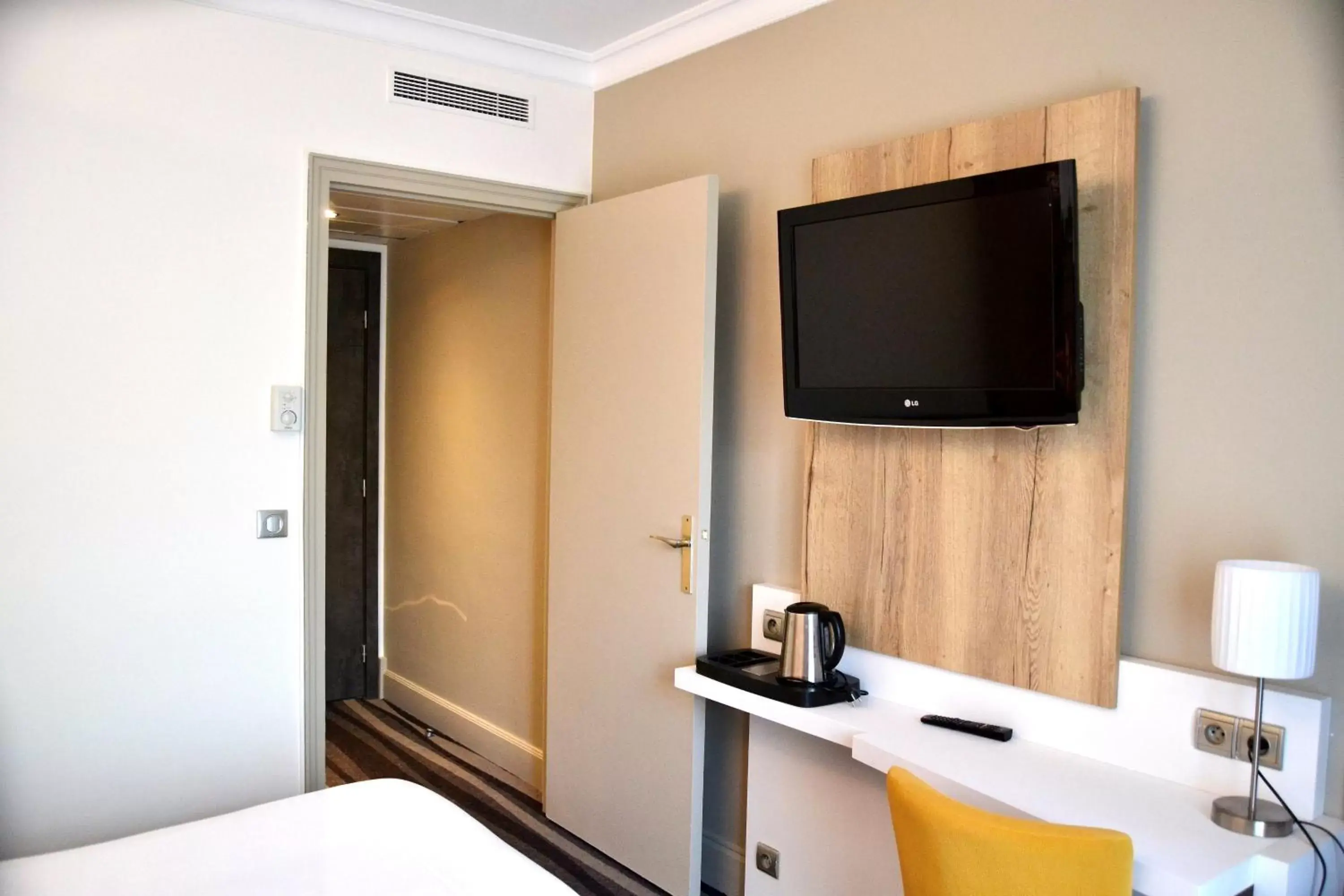 Bedroom, TV/Entertainment Center in Kyriad Hotel Tours Centre
