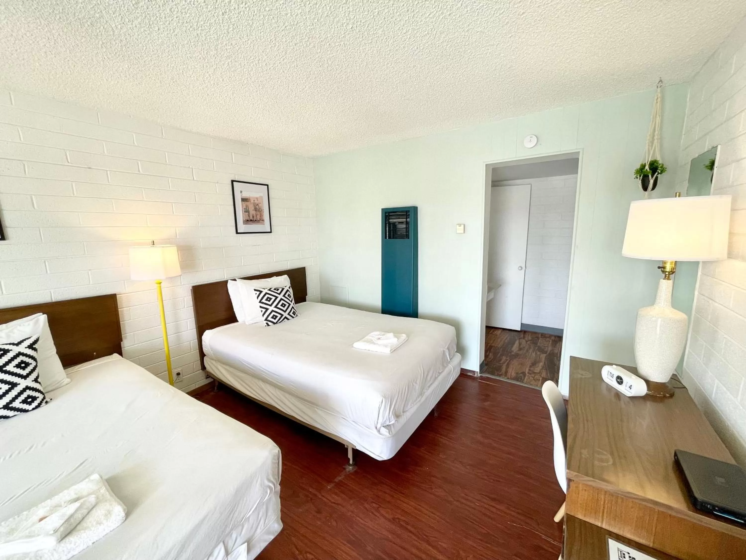 Bed in The Postcard Motel