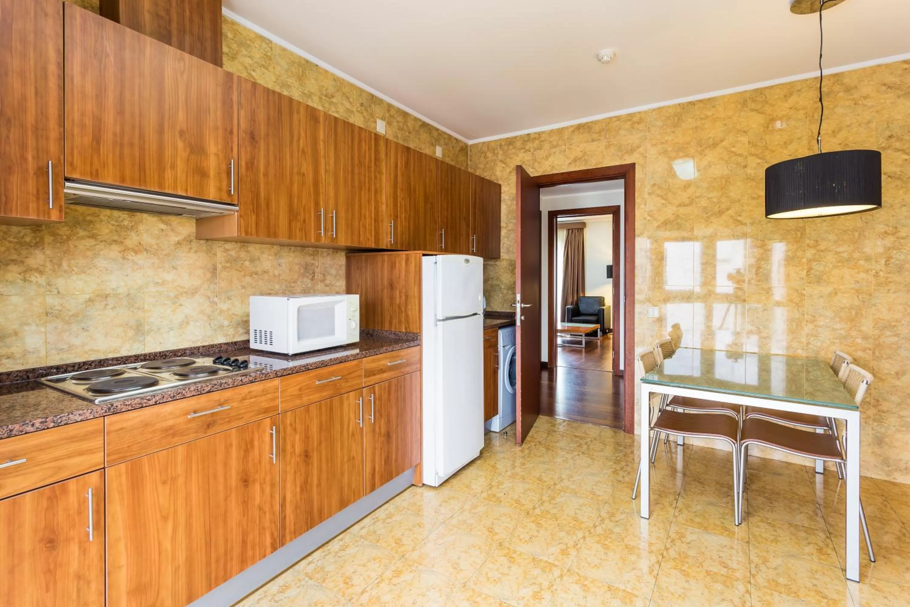 Kitchen or kitchenette in Legendary Lisboa Suites