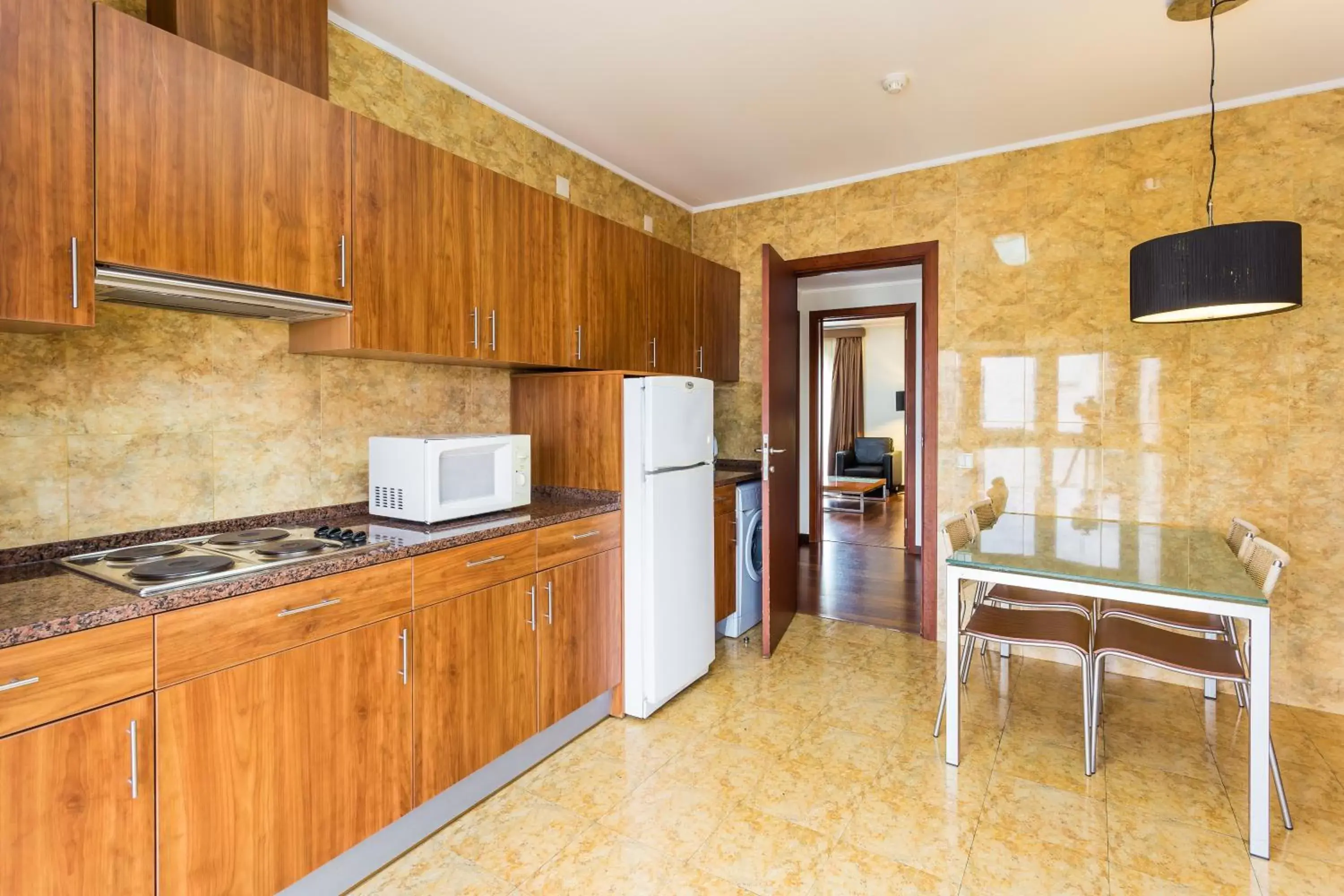 Kitchen/Kitchenette in Legendary Lisboa Suites