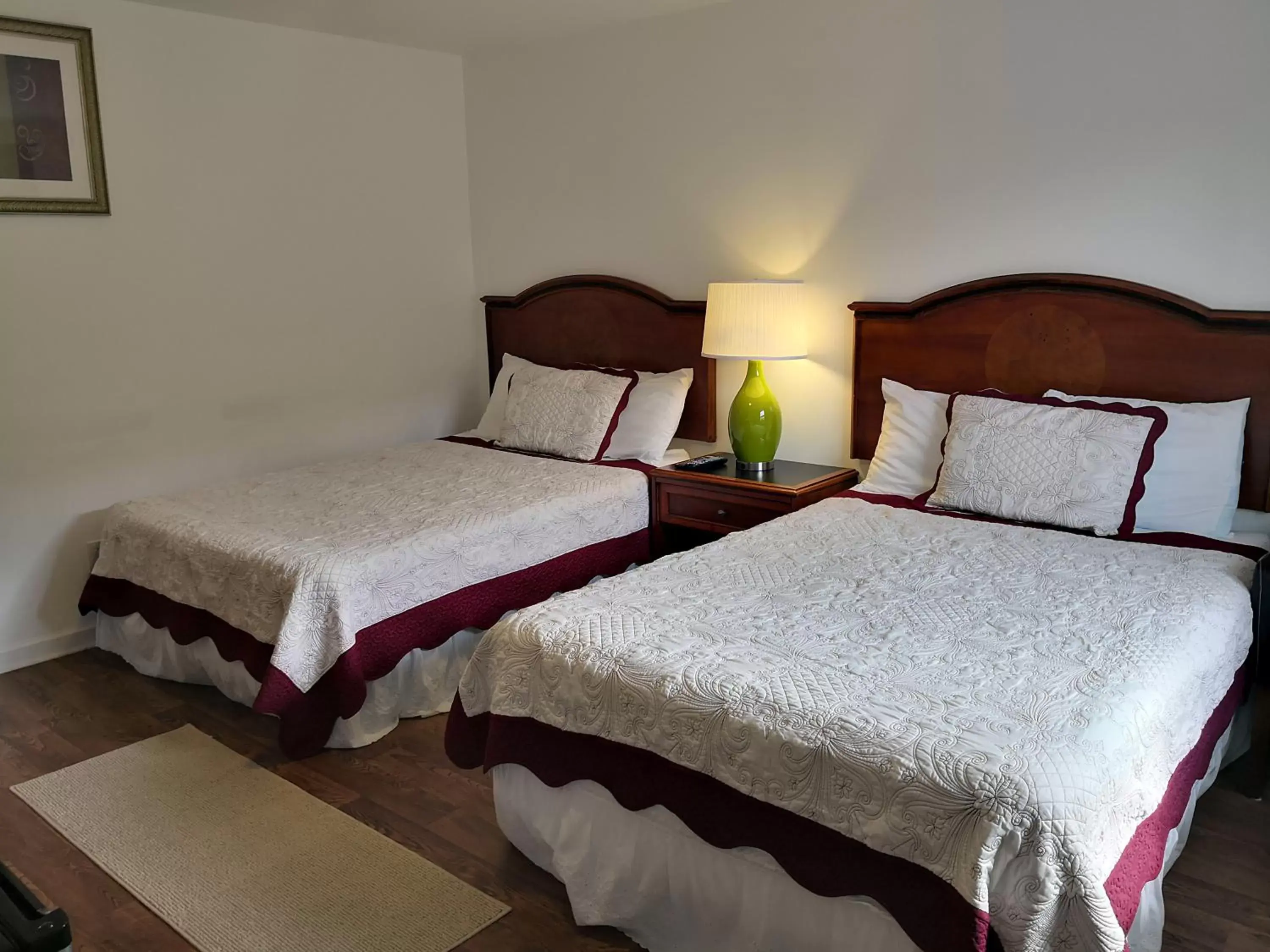 Bed in Apple Inn and Suites Cooperstown Area