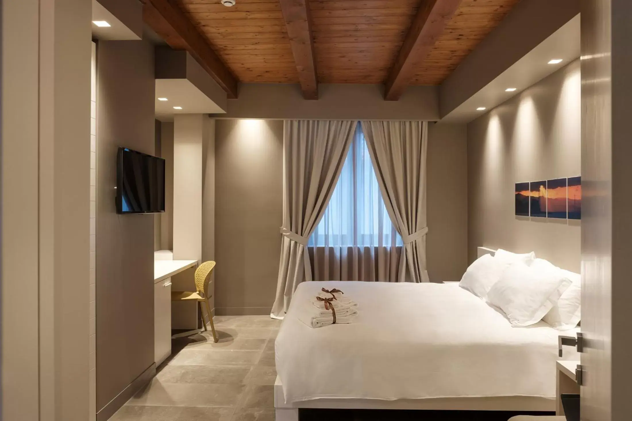 Bed in Il Casato Deluxe Rooms