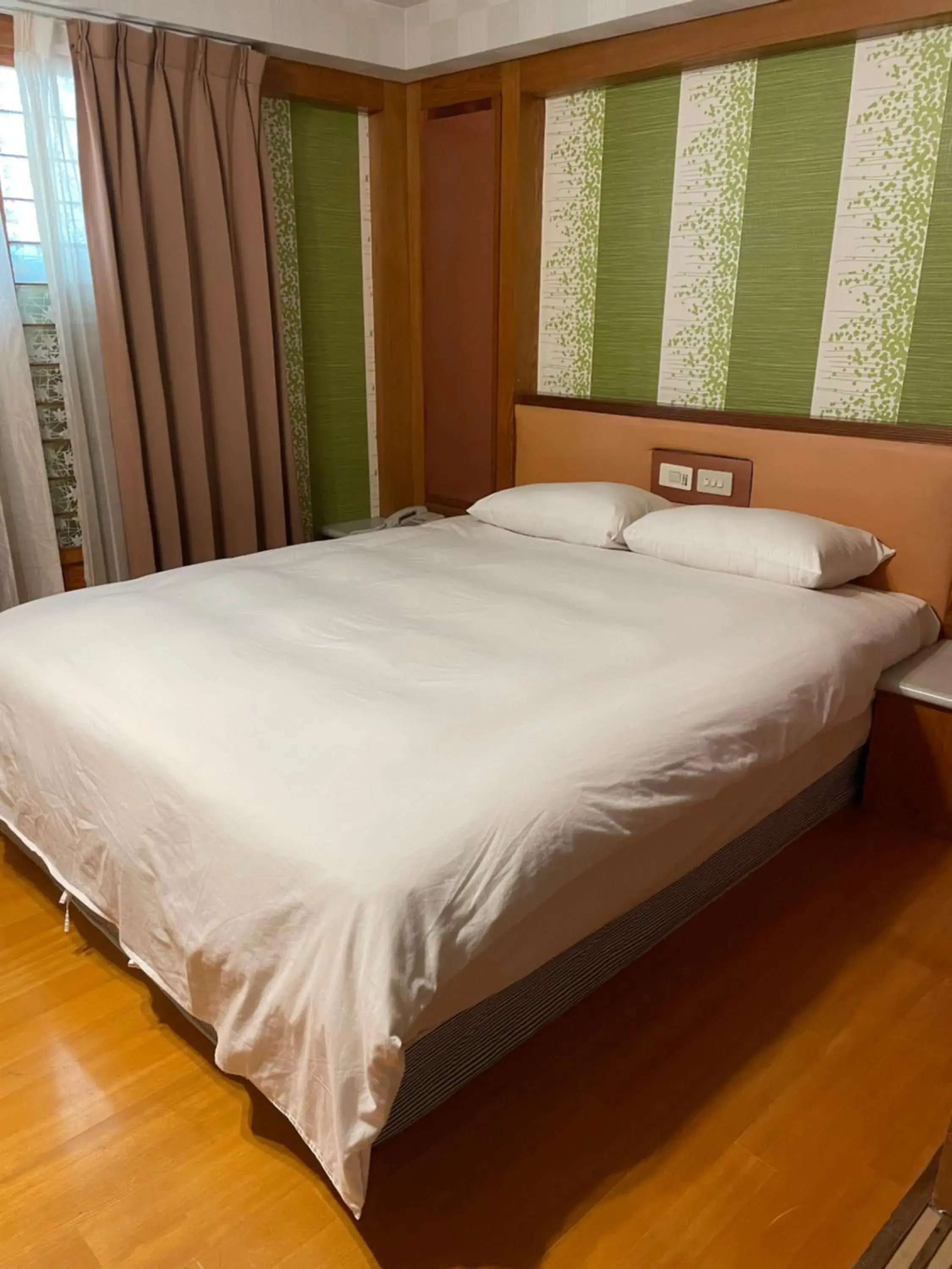 Bed in Mei-Hua Hotel