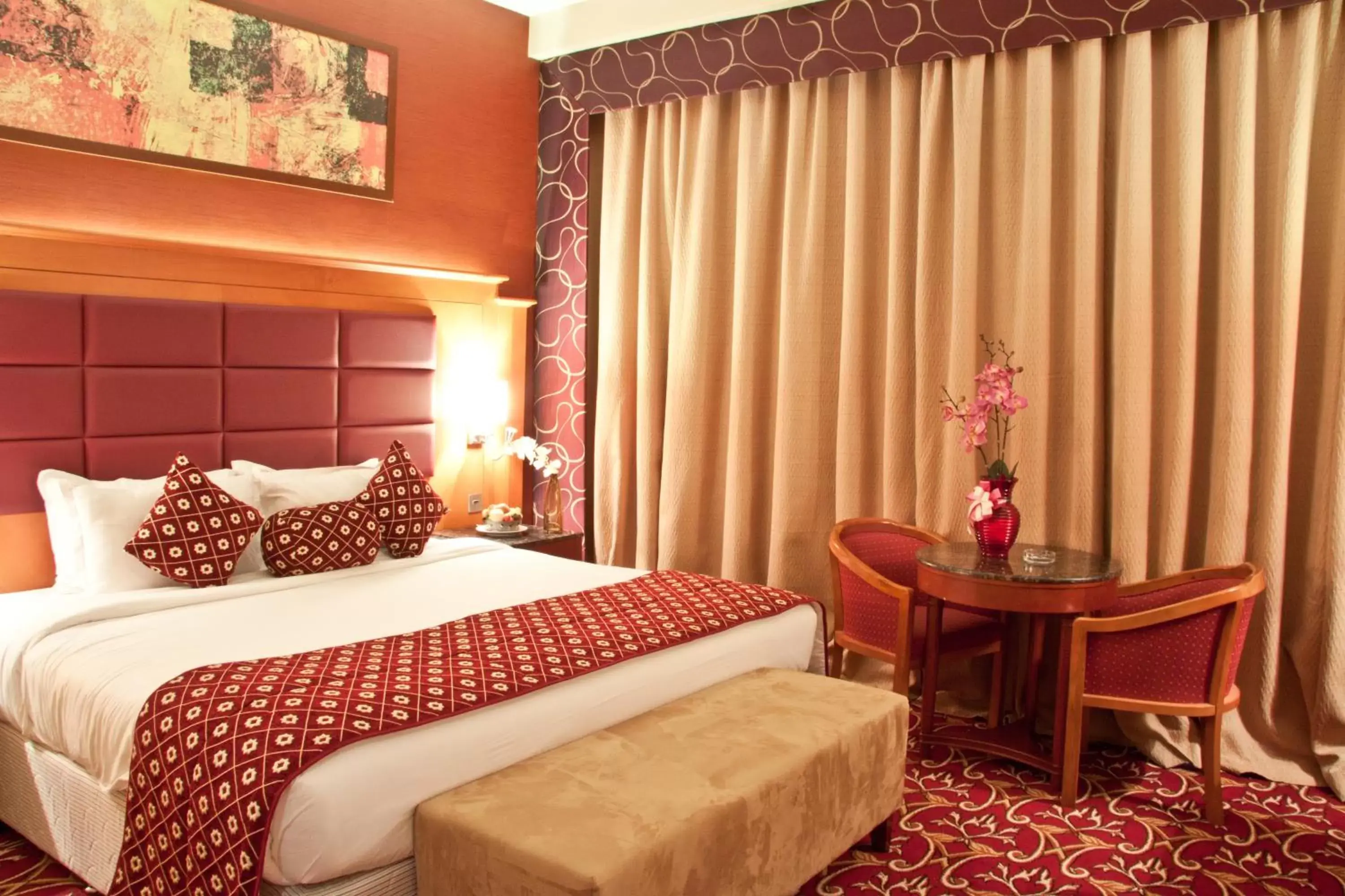 Bed in Ramee Rose Hotel