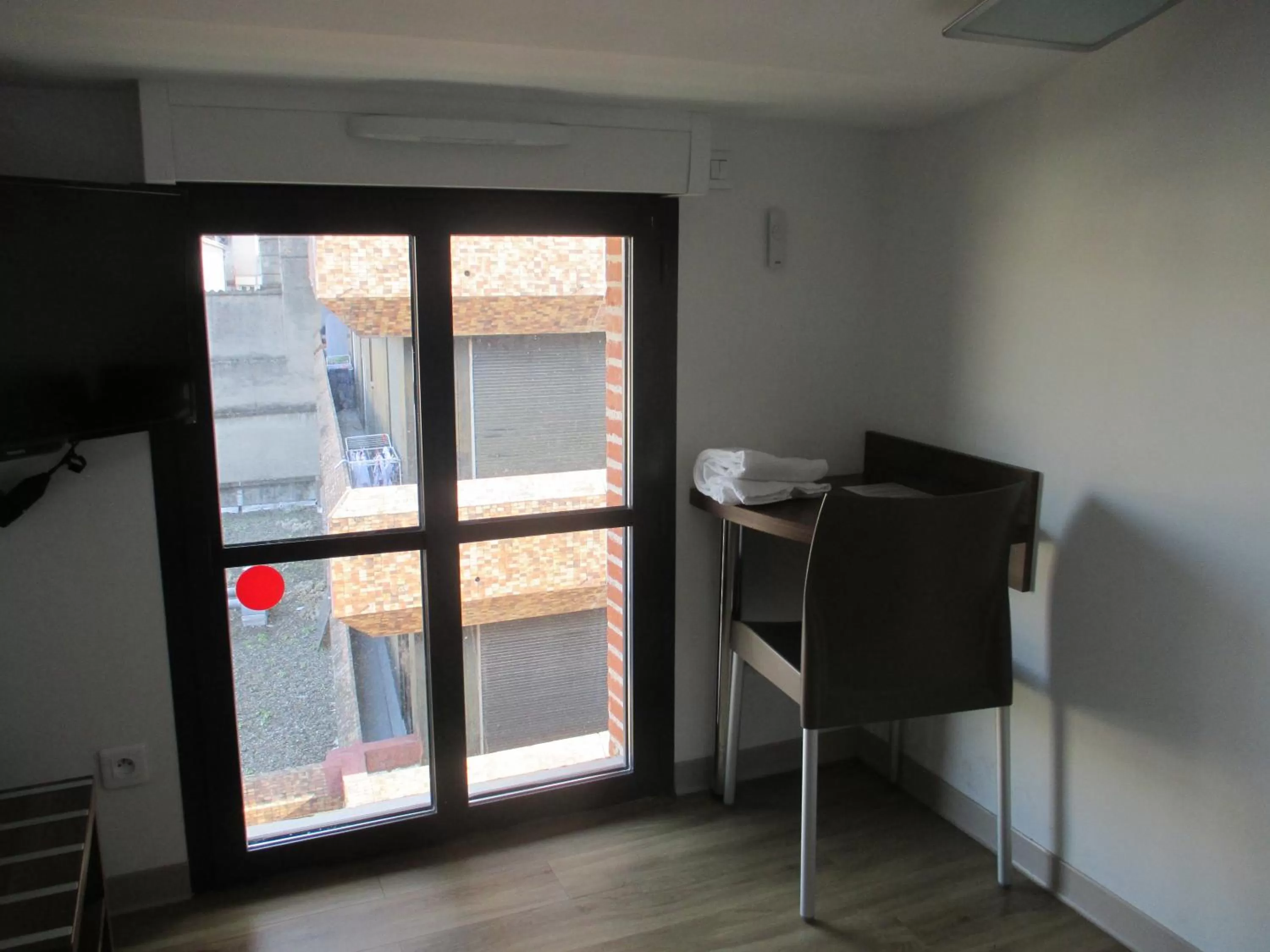 Bedroom in Hôtel le Pastel