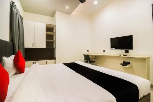 Bed in Hotel Nikhil Regency