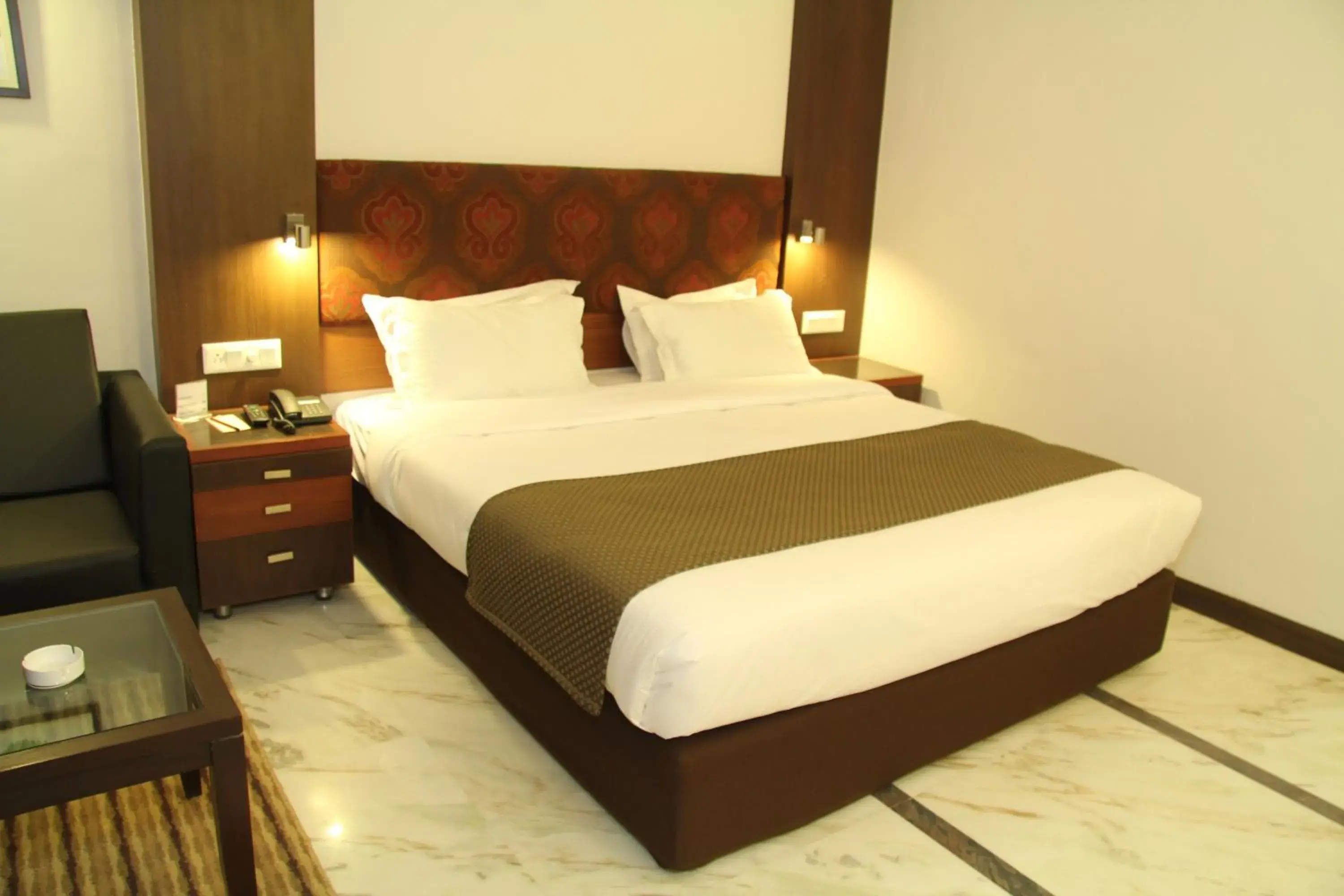 Bed in Amantra Comfort Hotel