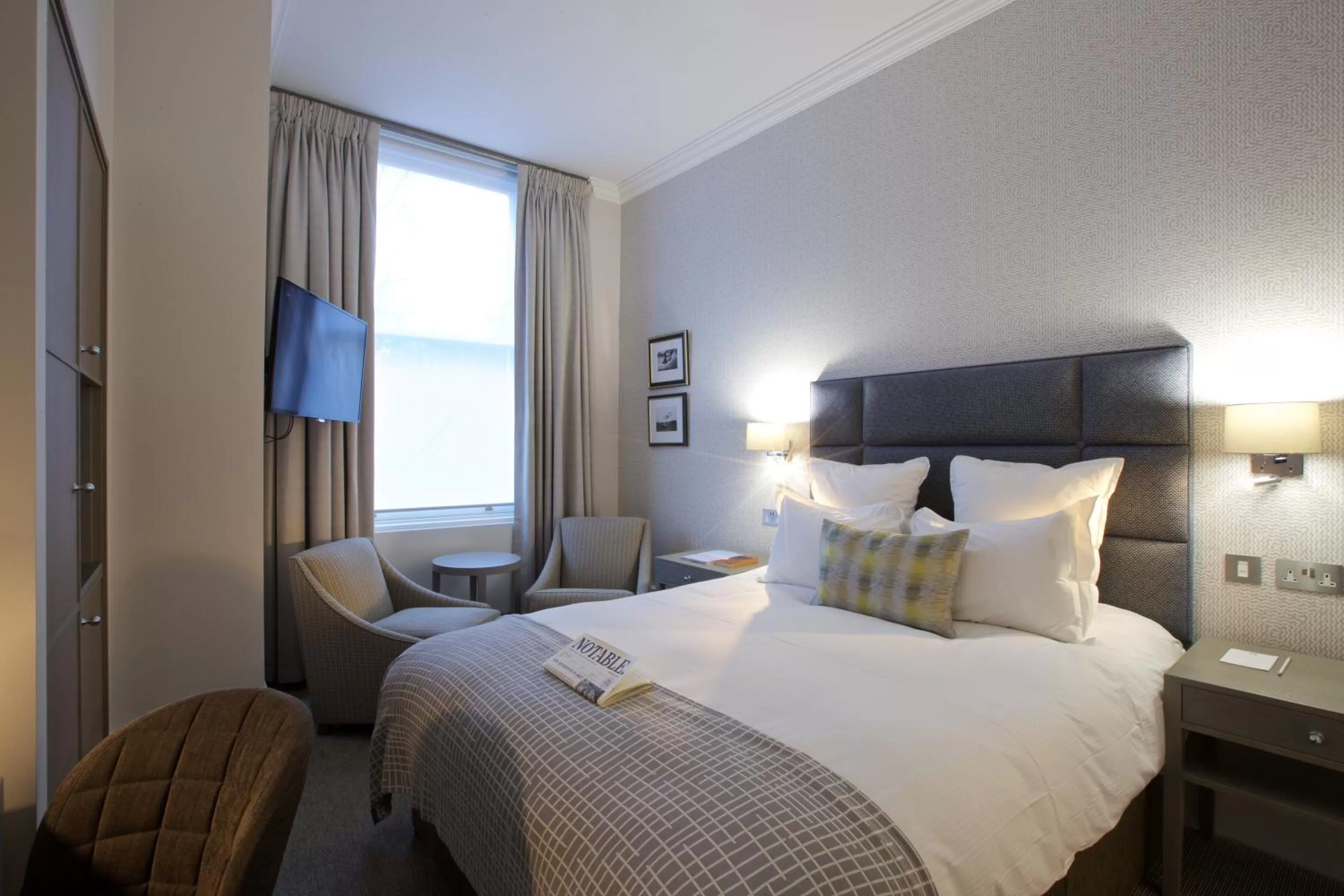 Bed in 54 Queen's Gate Hotel