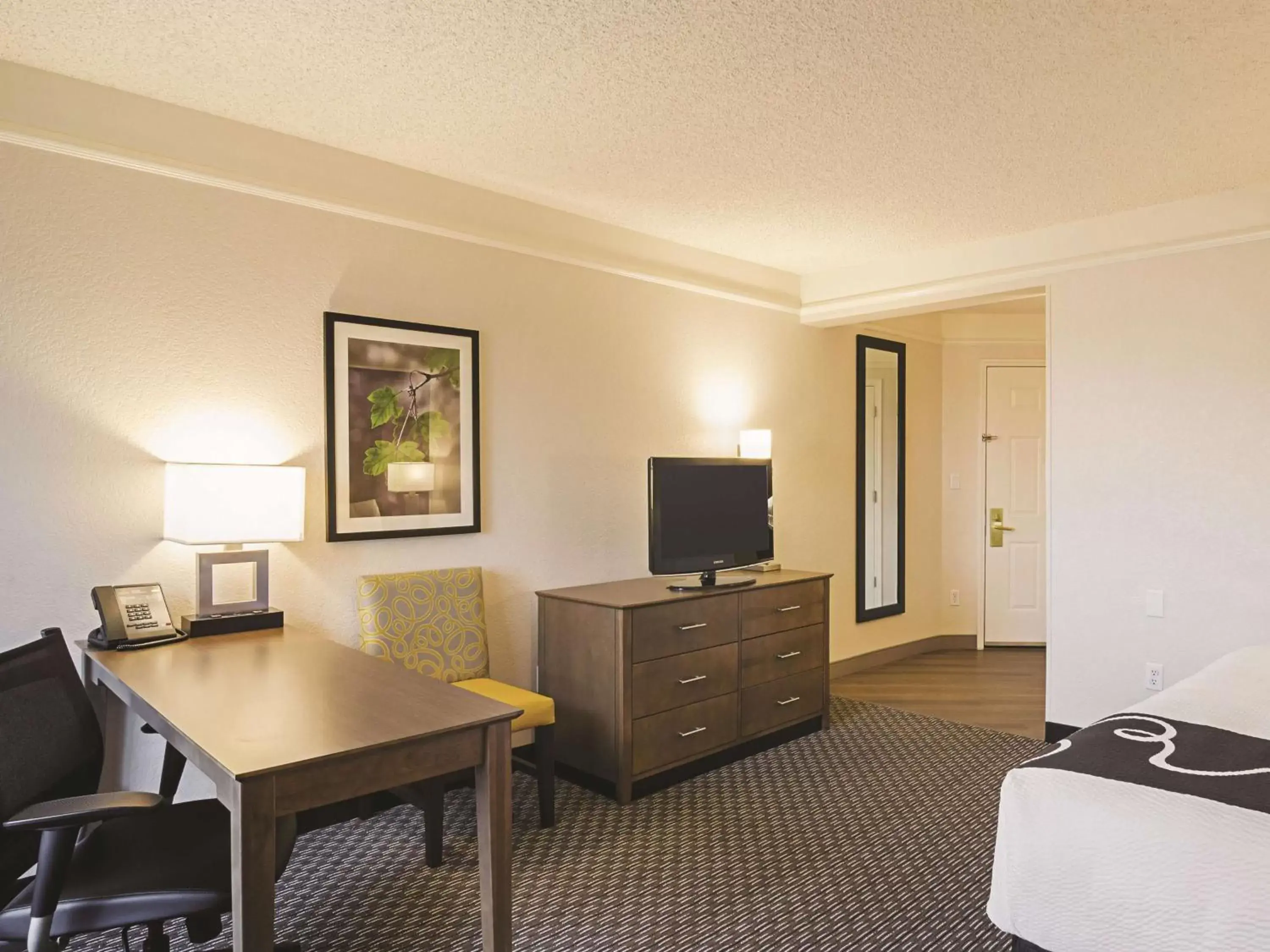 Photo of the whole room, TV/Entertainment Center in La Quinta by Wyndham Denver Airport DIA