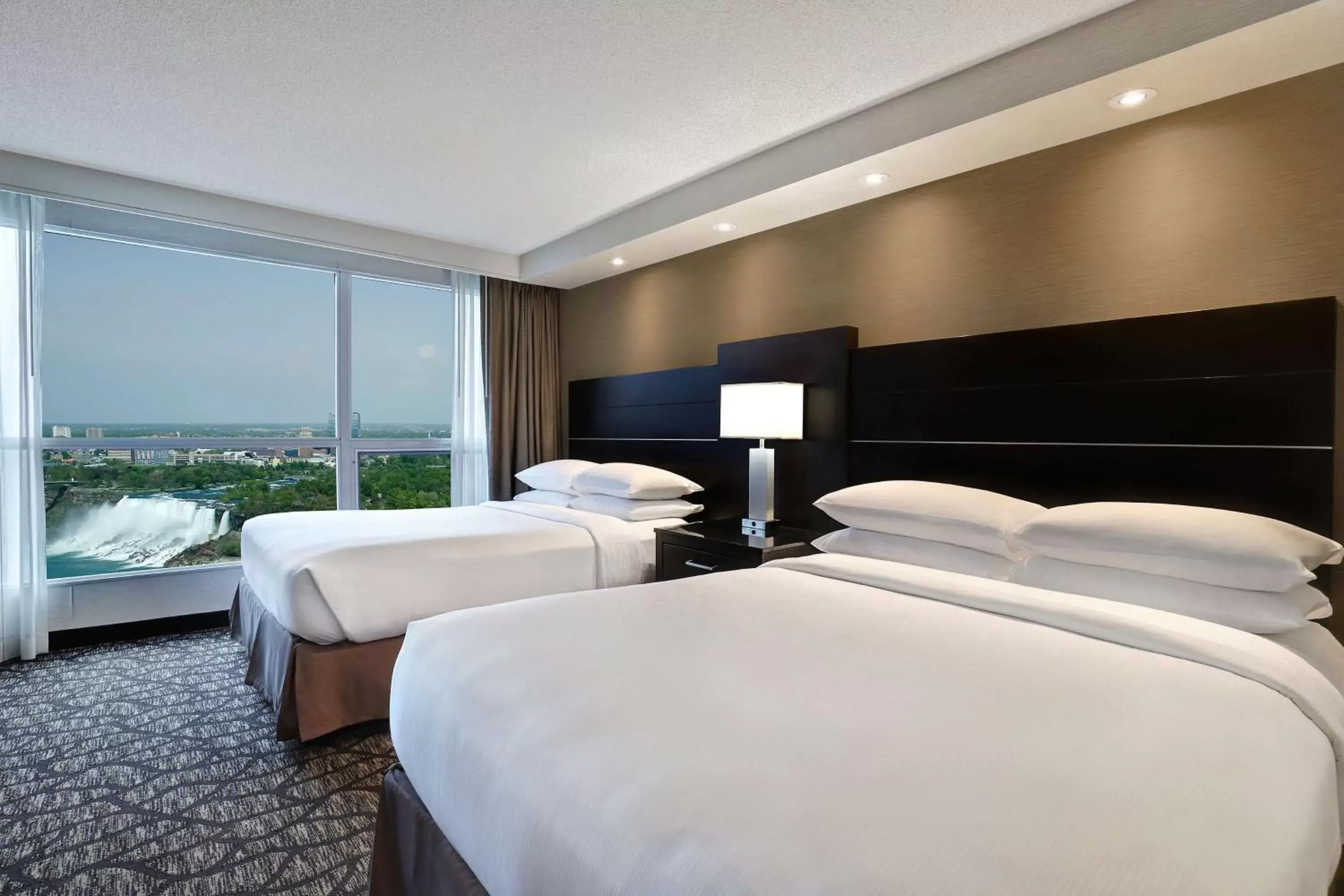 Bed in Embassy Suites by Hilton Niagara Falls/ Fallsview