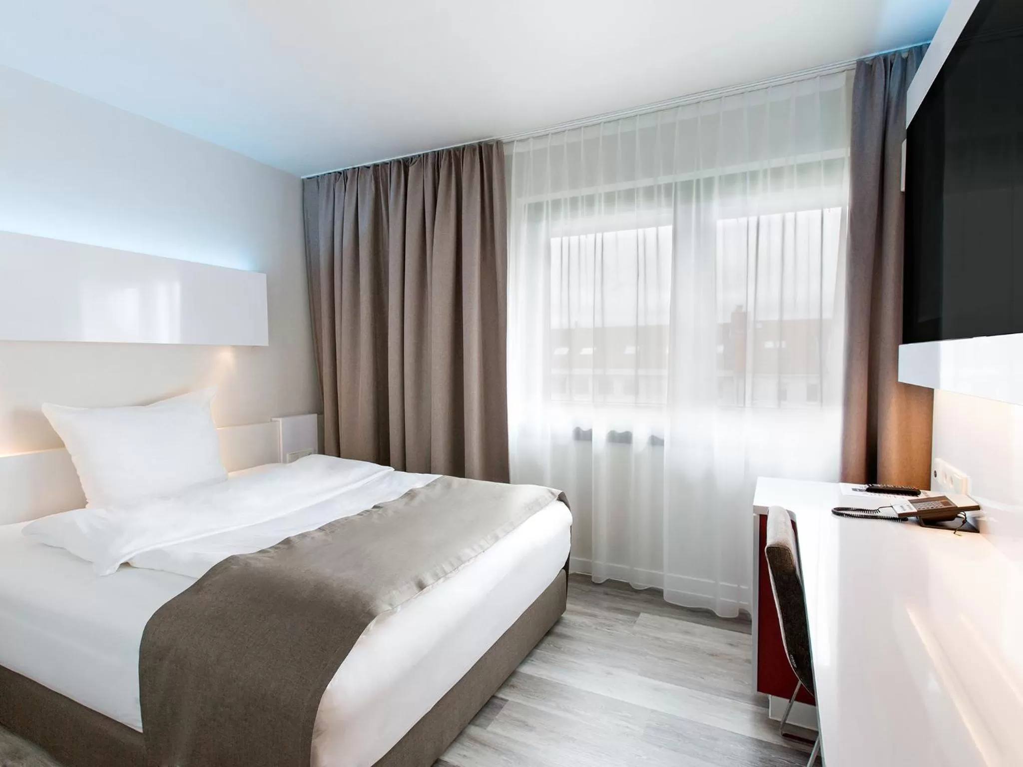 Photo of the whole room, Bed in DORMERO Hotel Hannover