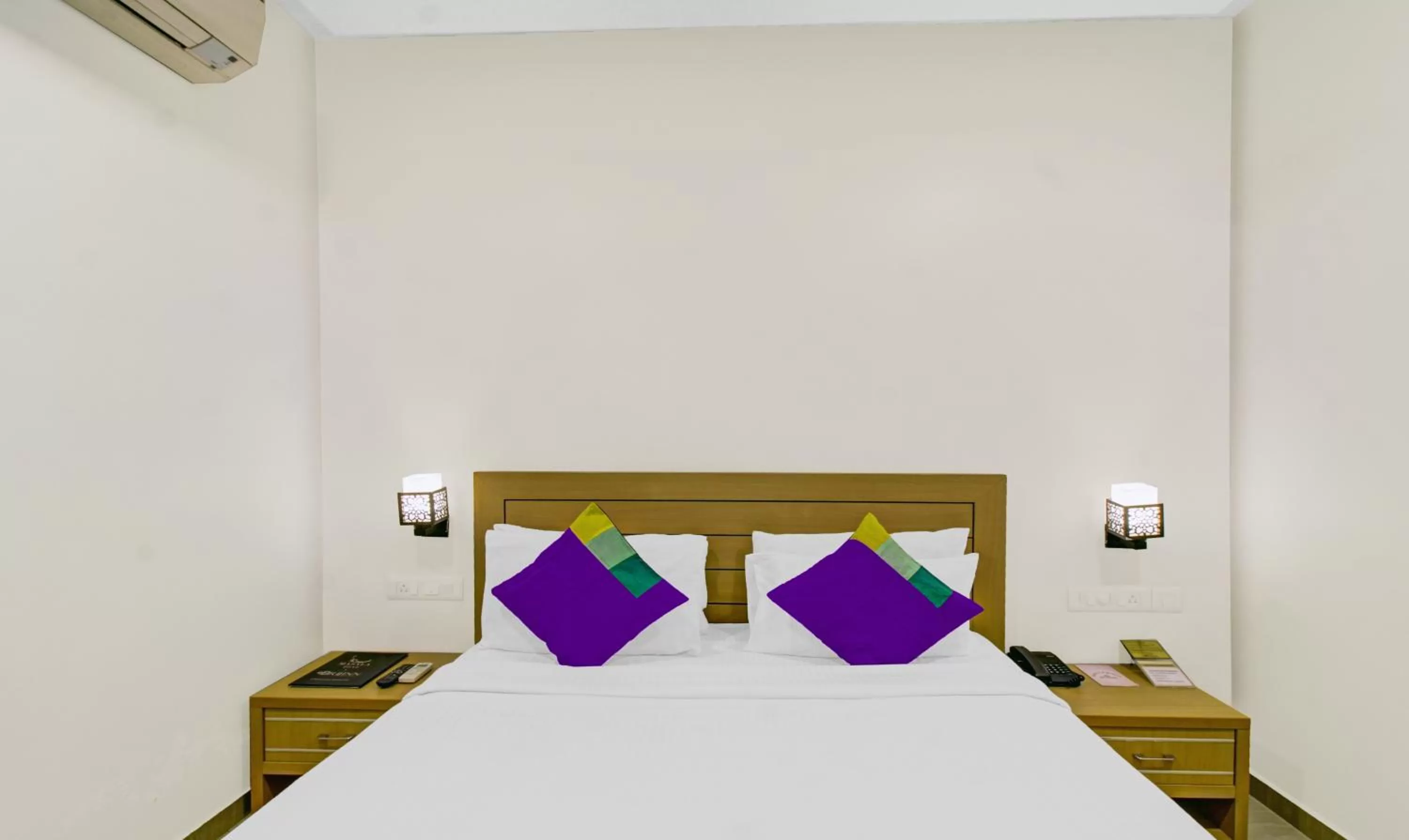 Bedroom, Bed in Treebo Premium Brijinn