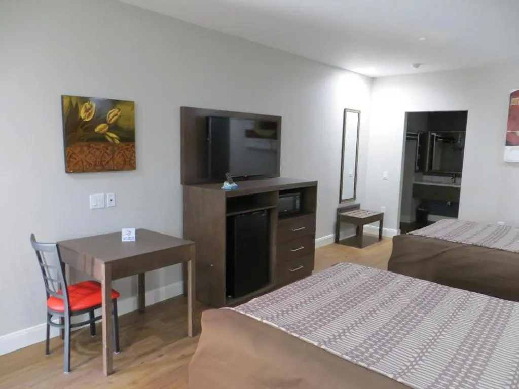 Bedroom, Bed in Grand Villa Inn and Suites Westchase/Chinatown