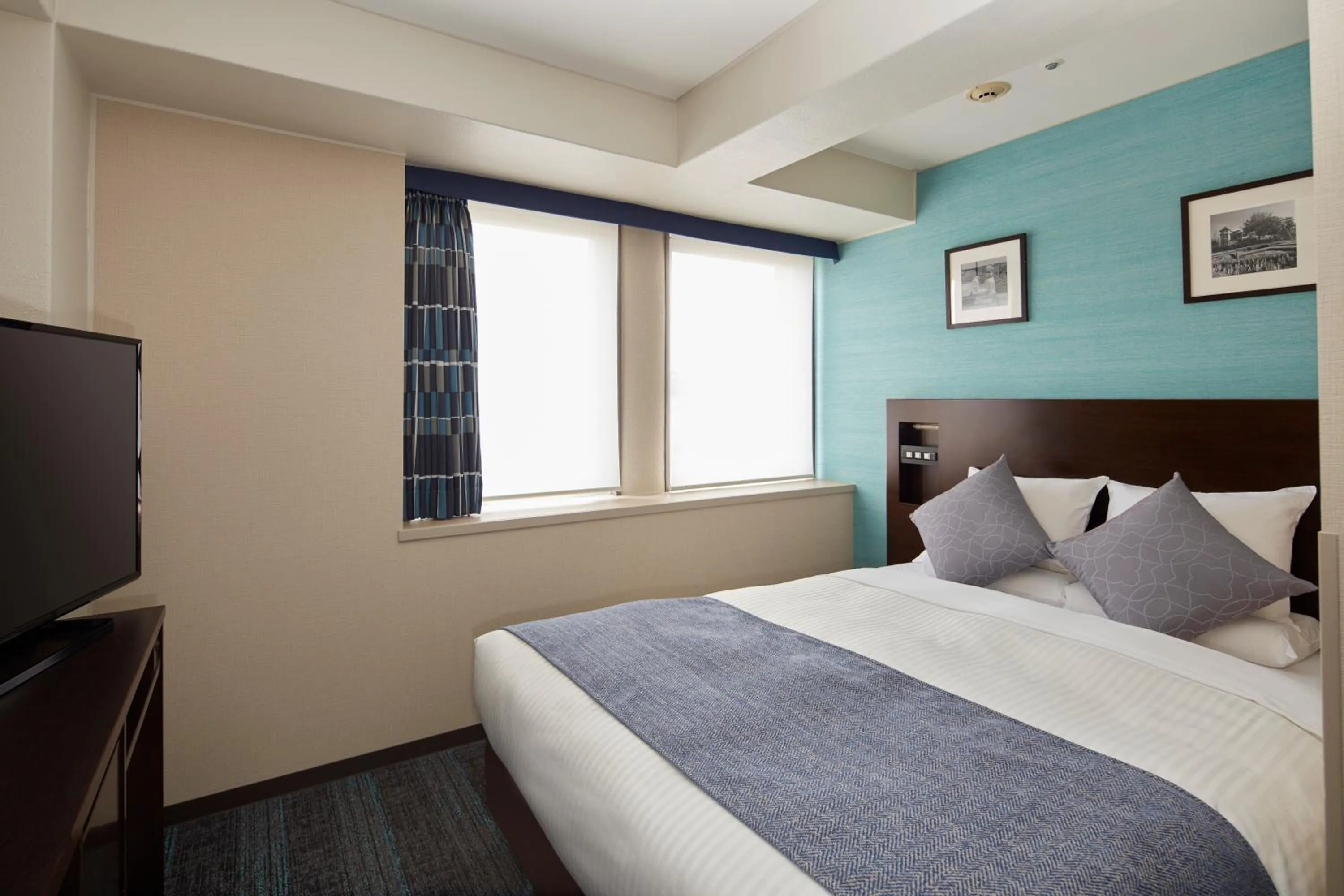 Bed in HOTEL MYSTAYS Yokohama