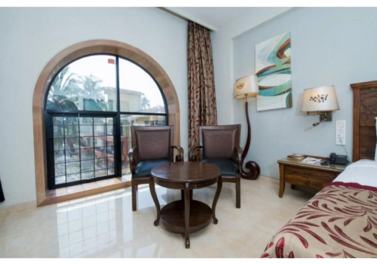 Living room, Bed in Neelam's The Grand Hotel Goa