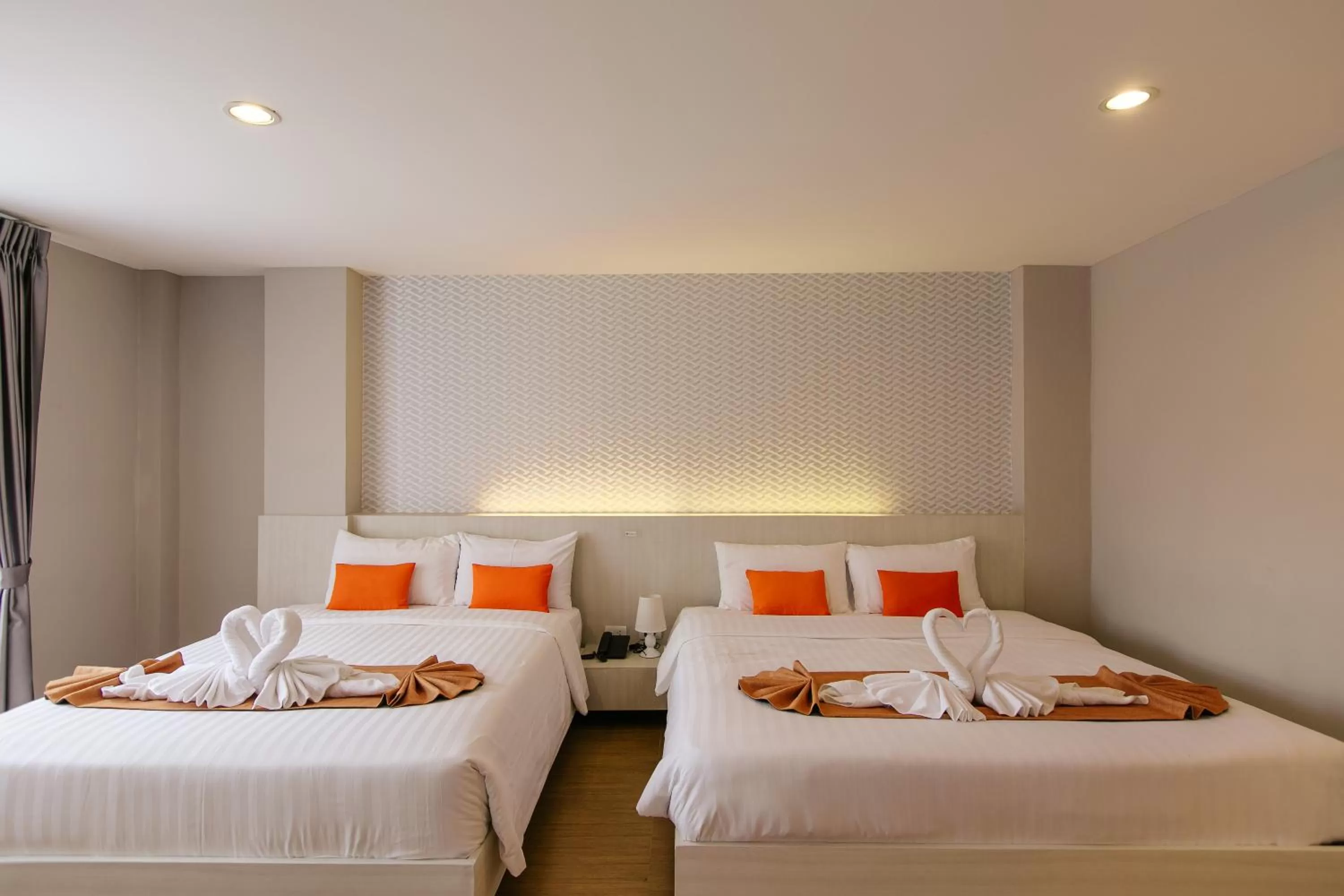 Bed in De Hug Hotel & Residence