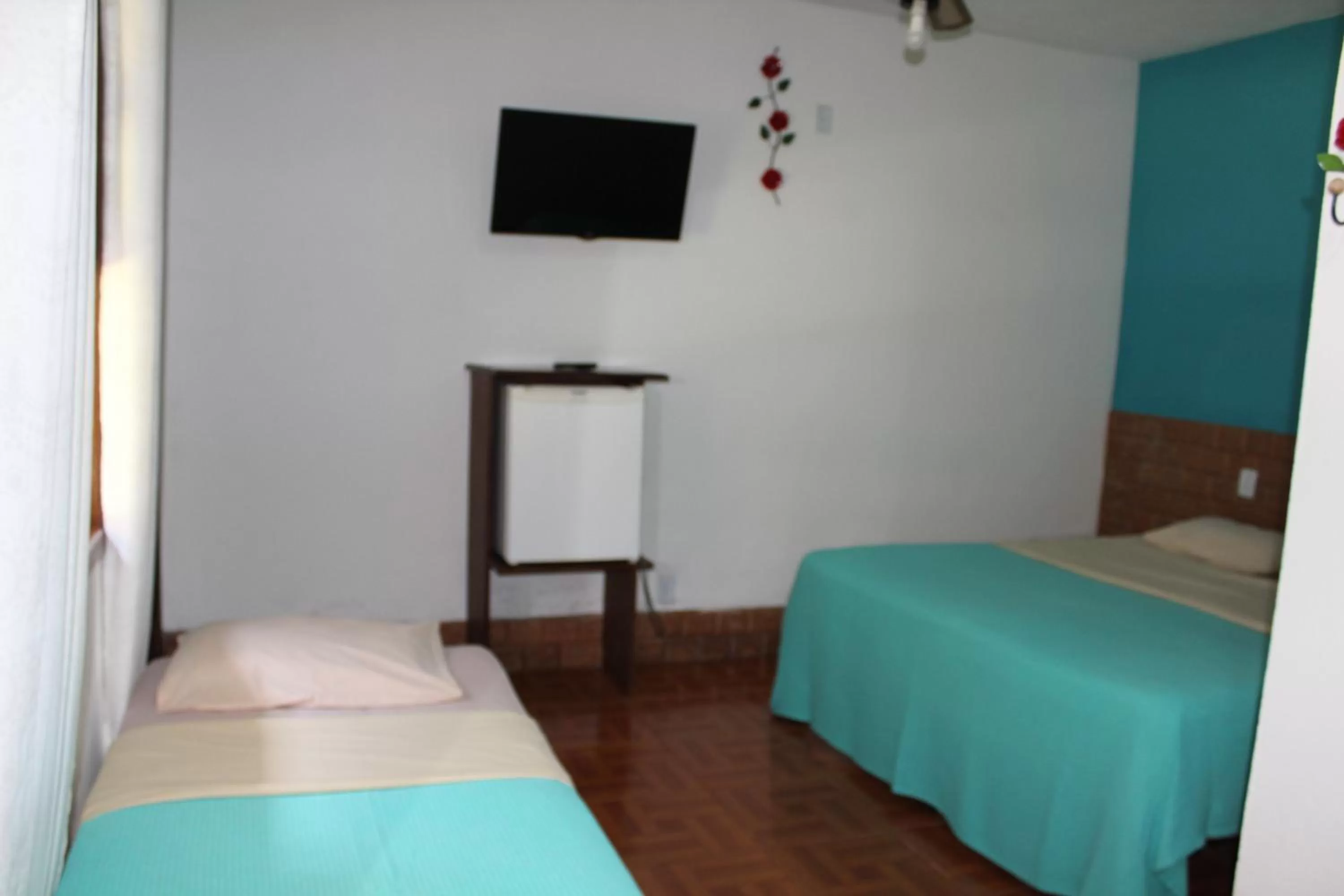 Bed in Pousada Flor de Paraty