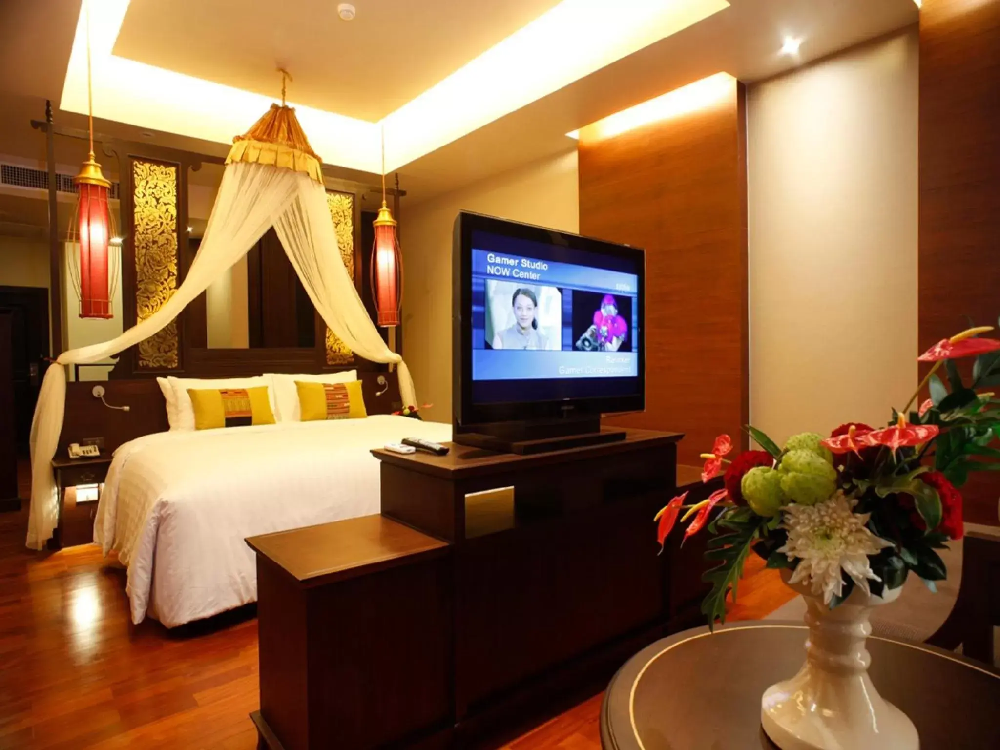 Bed, TV/Entertainment Center in Siripanna Villa Resort & Spa Chiang Mai -SHA Extra Plus