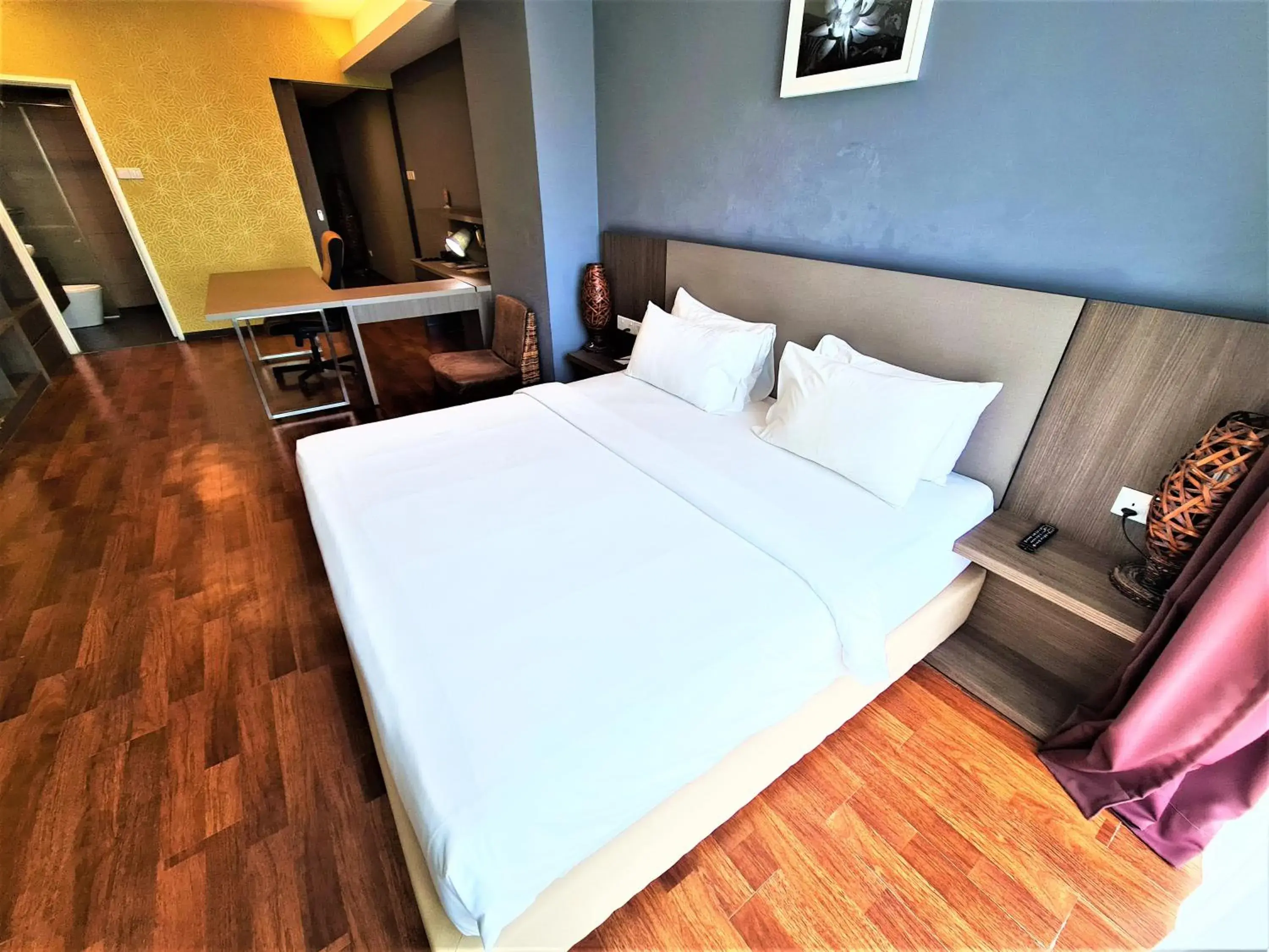 Bed in Nexus Business Suite Hotel