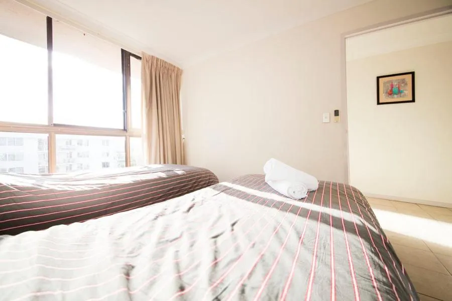Bed in Warringa Surf Holiday Apartments