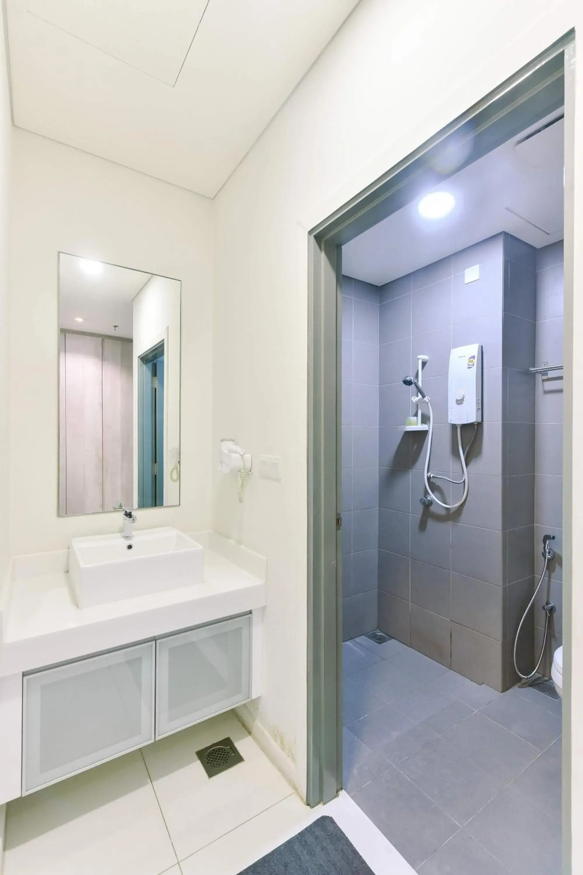 Bathroom in Summer Suites Residences by Subhome