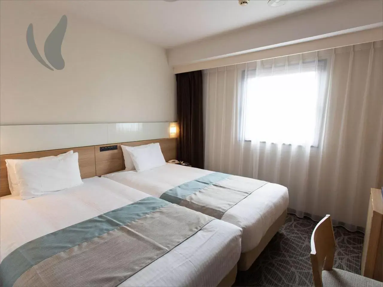 Photo of the whole room, Bed in Hotel Hokke Club Naha Shintoshin