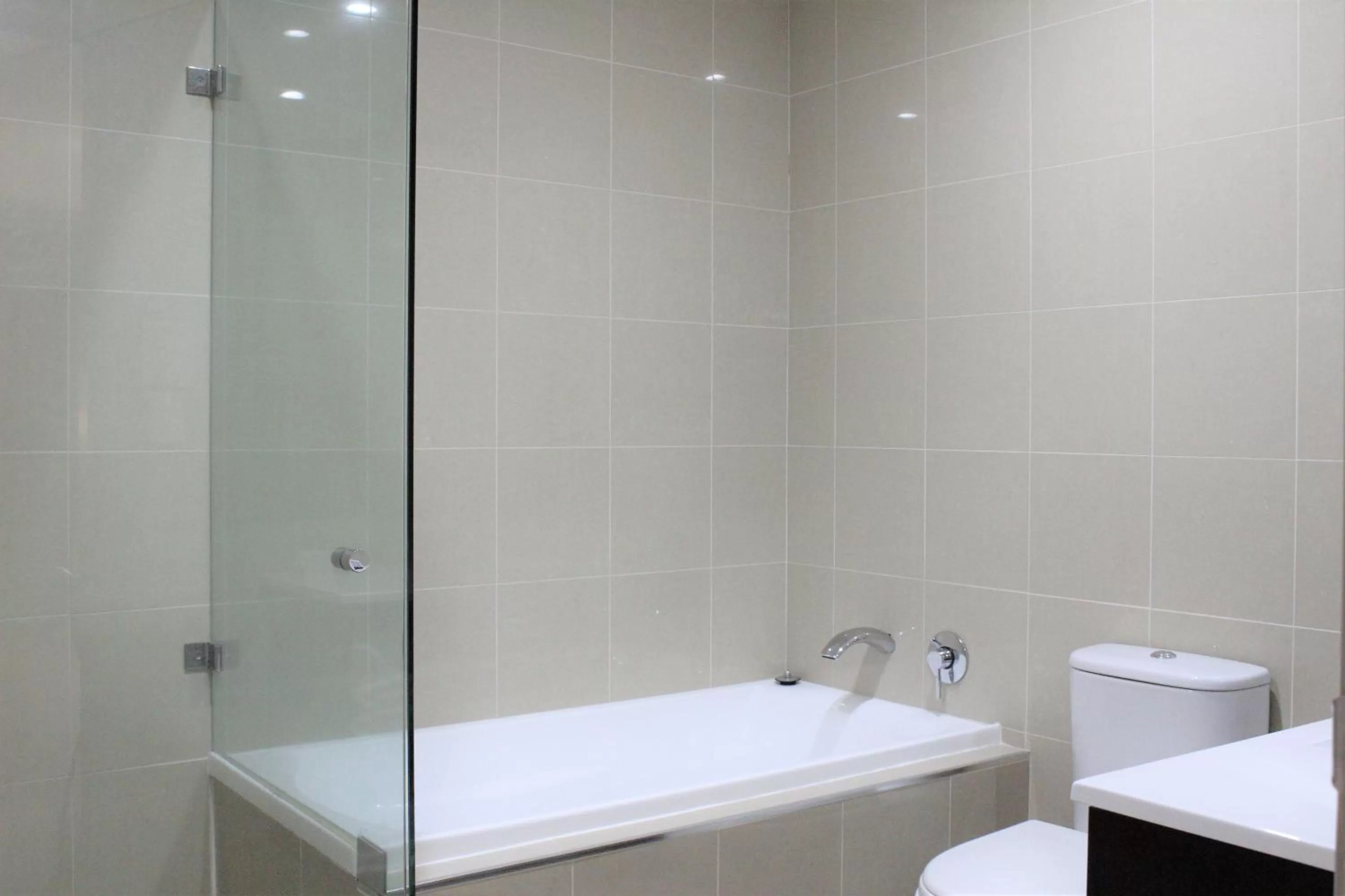 Bathroom in Carlyle Suites & Apartments