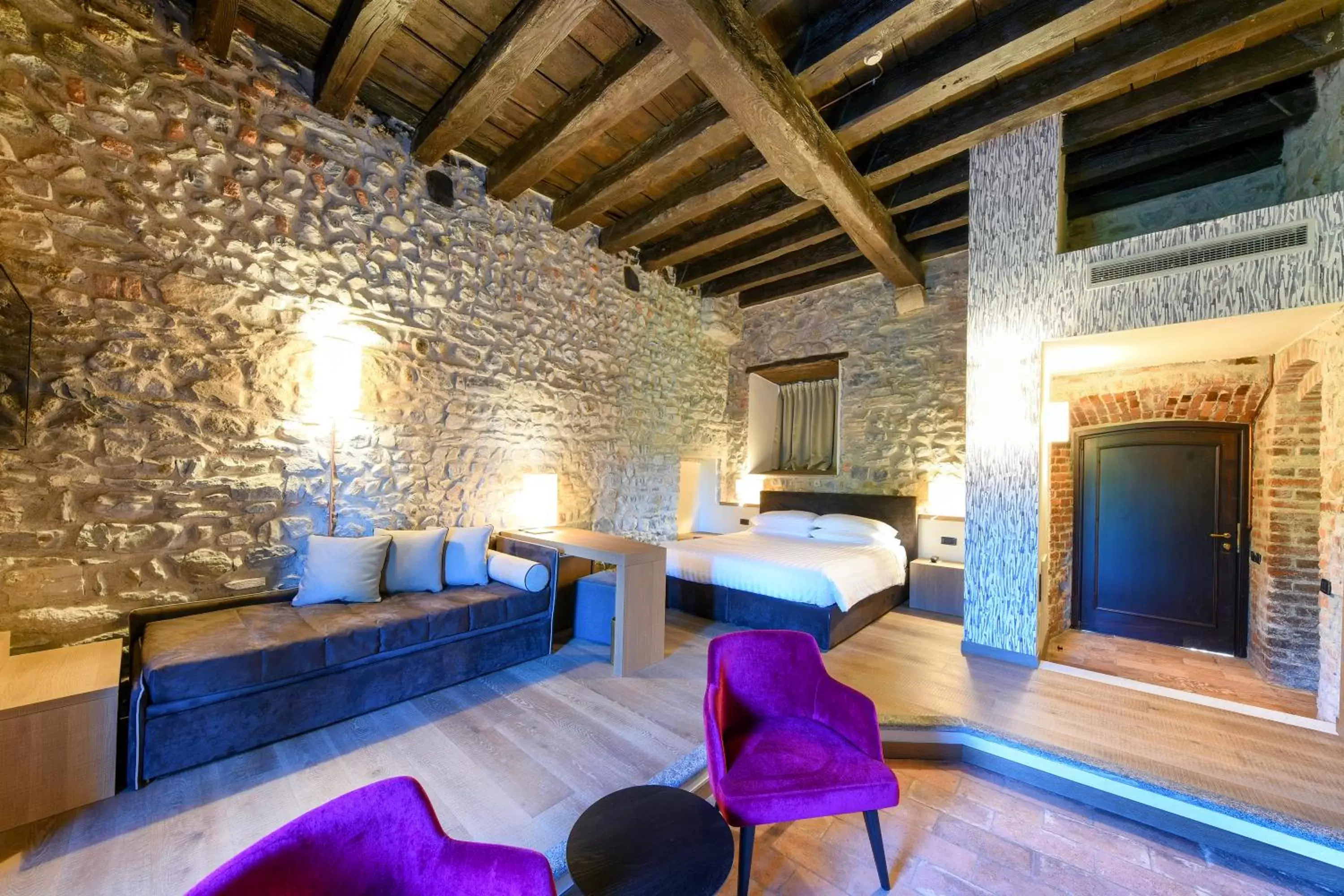 Bedroom, Seating Area in Relais Castello Di Casiglio