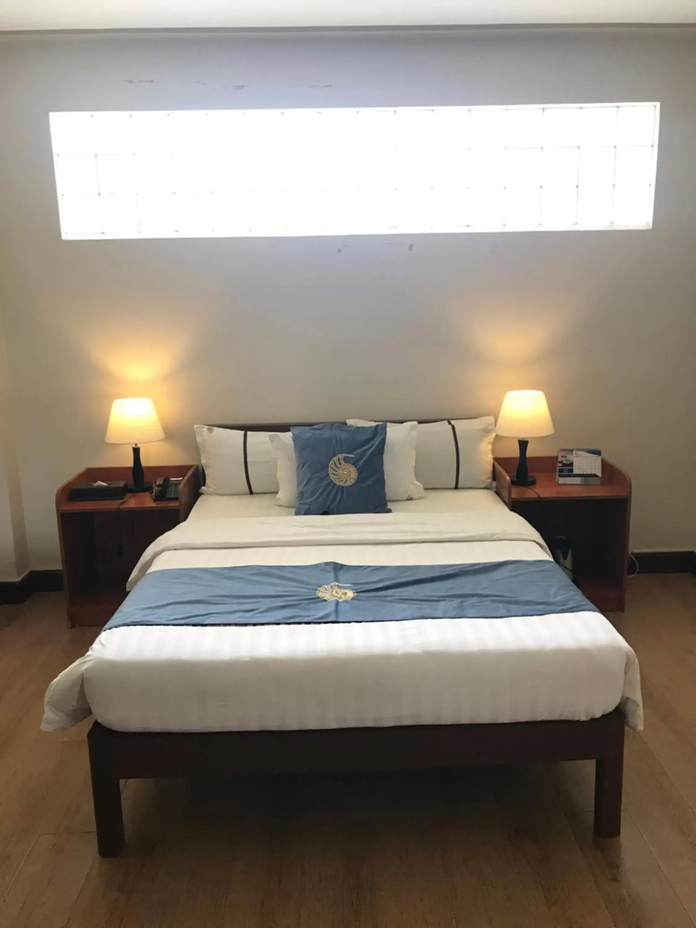 Bed in Costa Palawan Resort