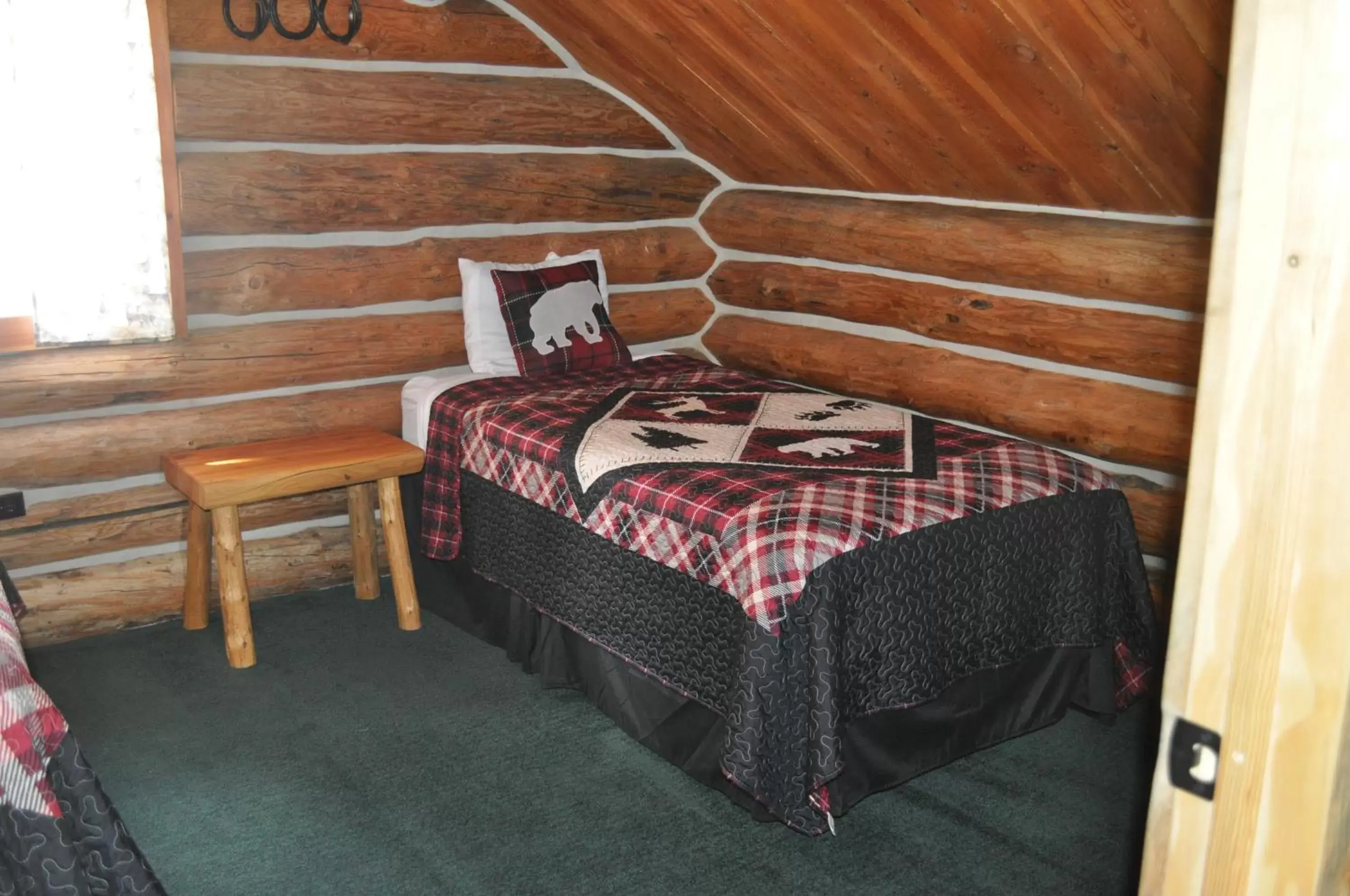 Bed in Crooked Creek Guest Ranch