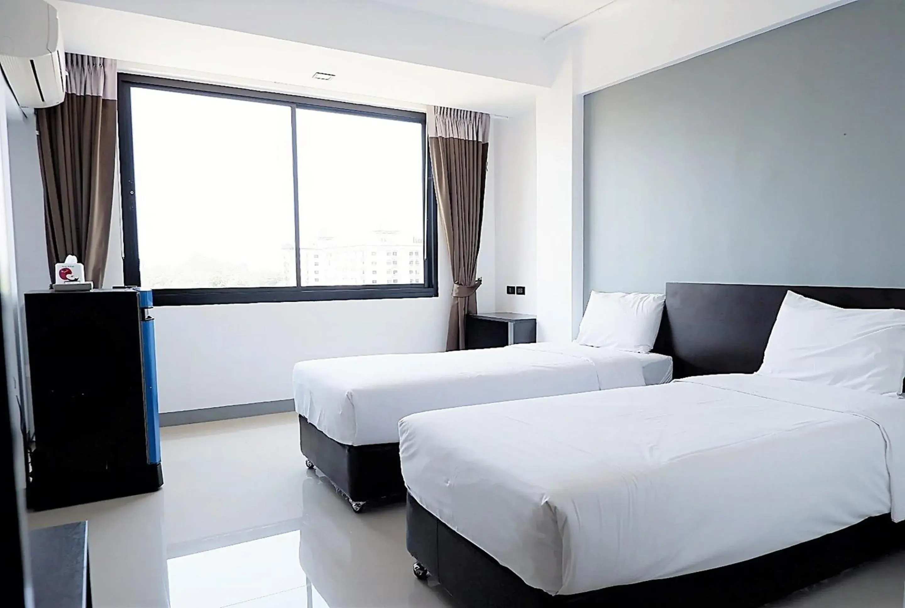 Bed in Izen Budget Hotel & Residence