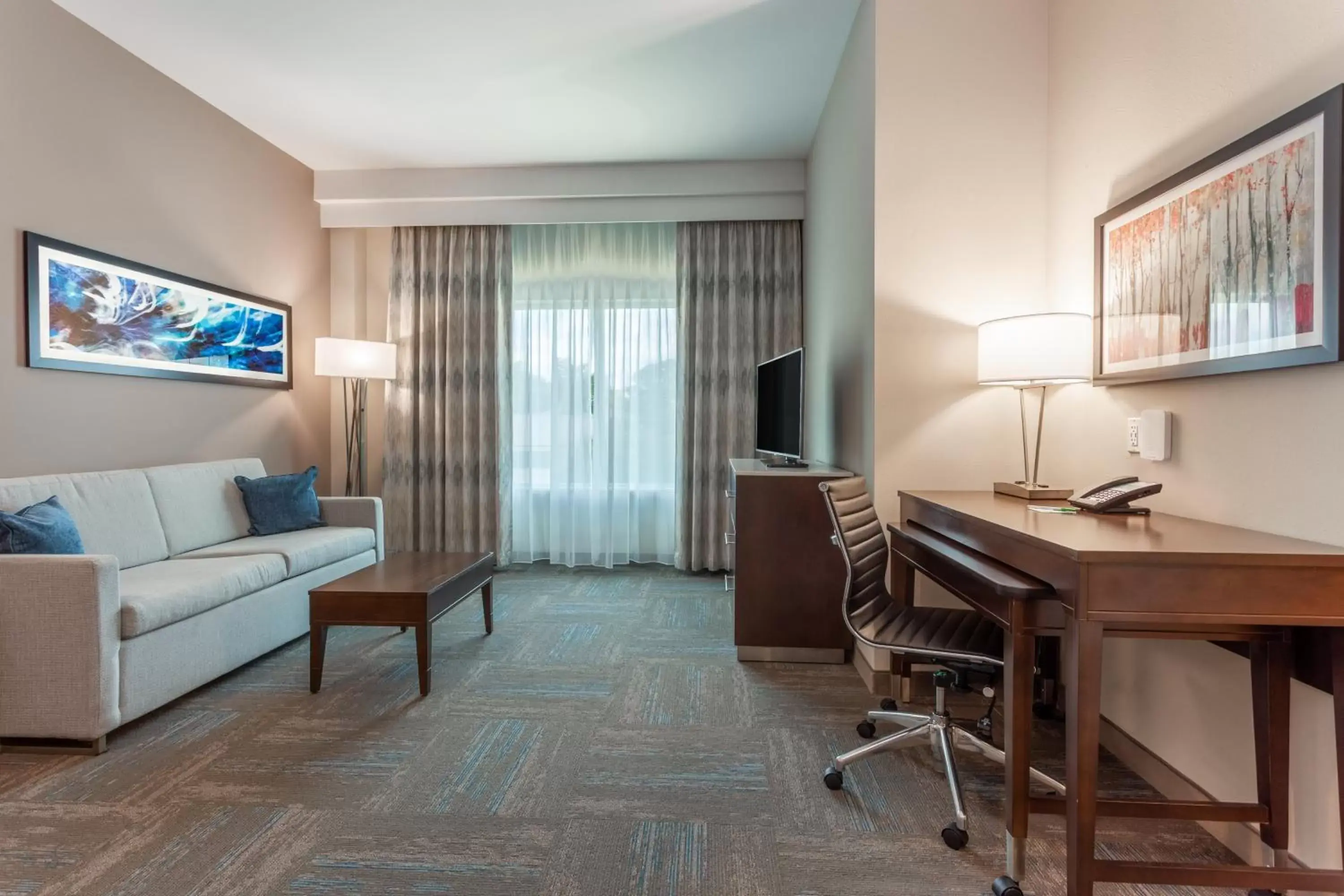 TV and multimedia, Seating Area in Holiday Inn & Suites - Jefferson City, an IHG Hotel