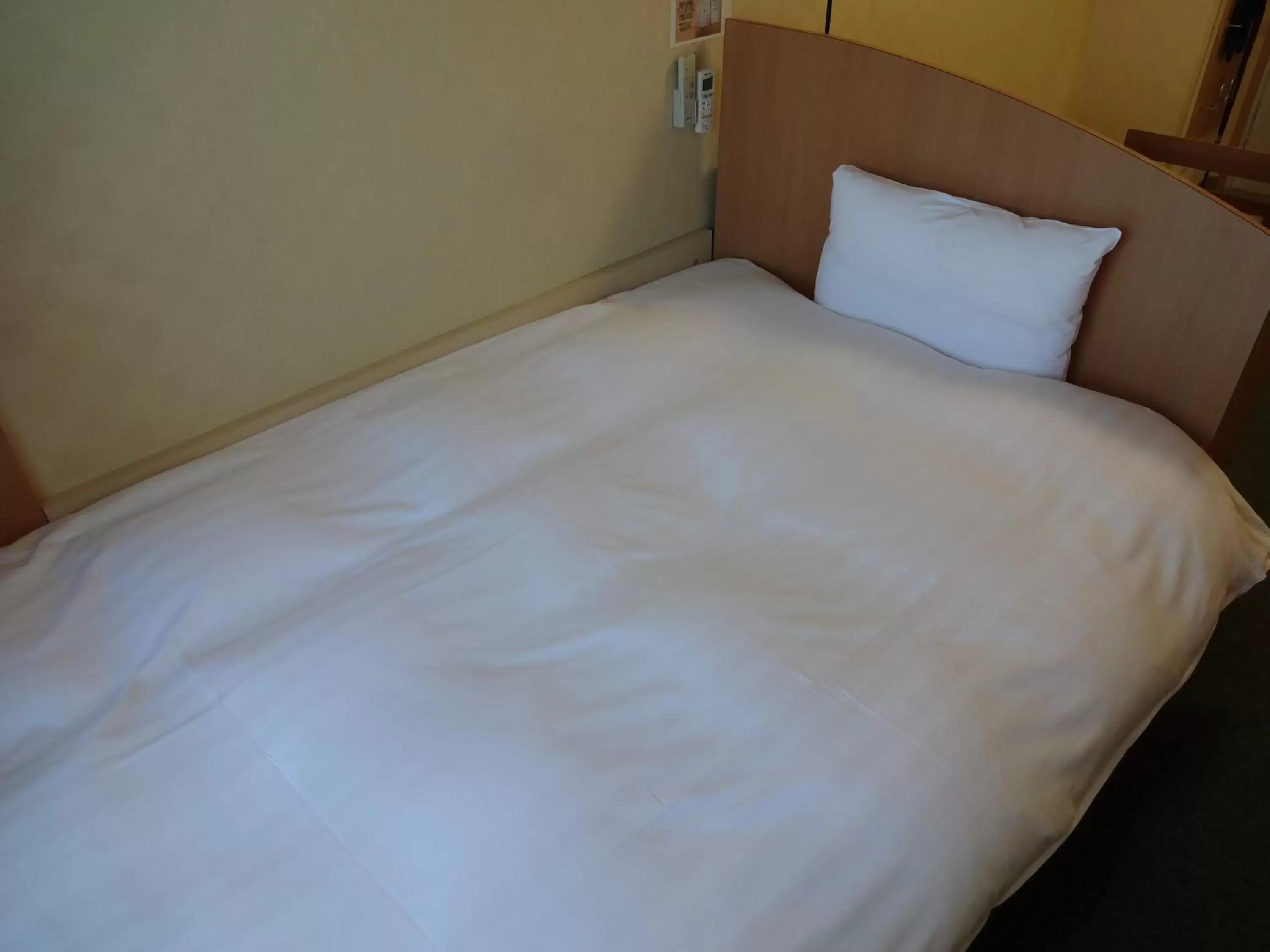 Bed in Tennen Onsen Taho-no-Yu Dormy Inn Niigata