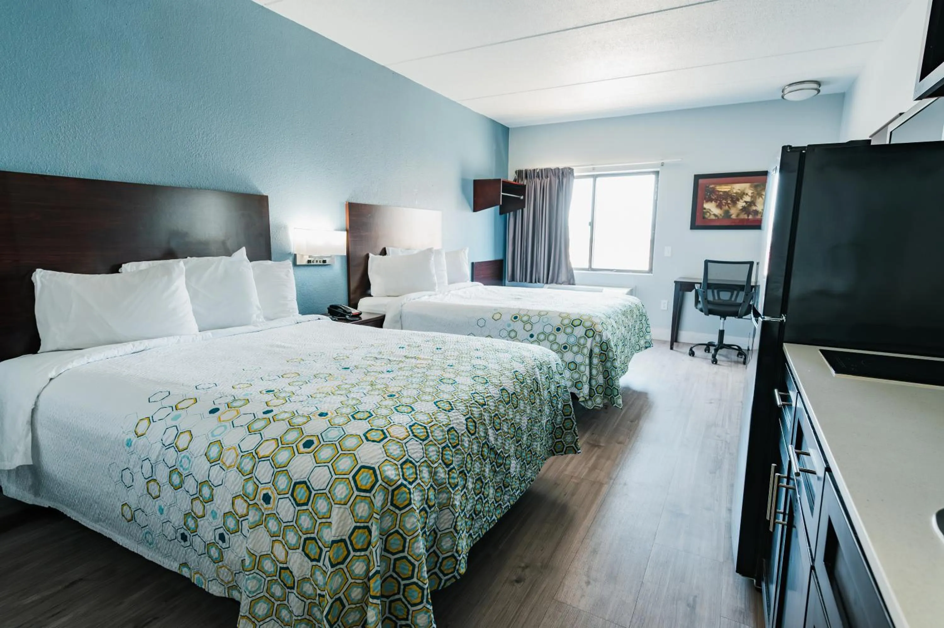 Bed in HomeTowne Studios by Red Roof San Antonio - SeaWorld Northwest