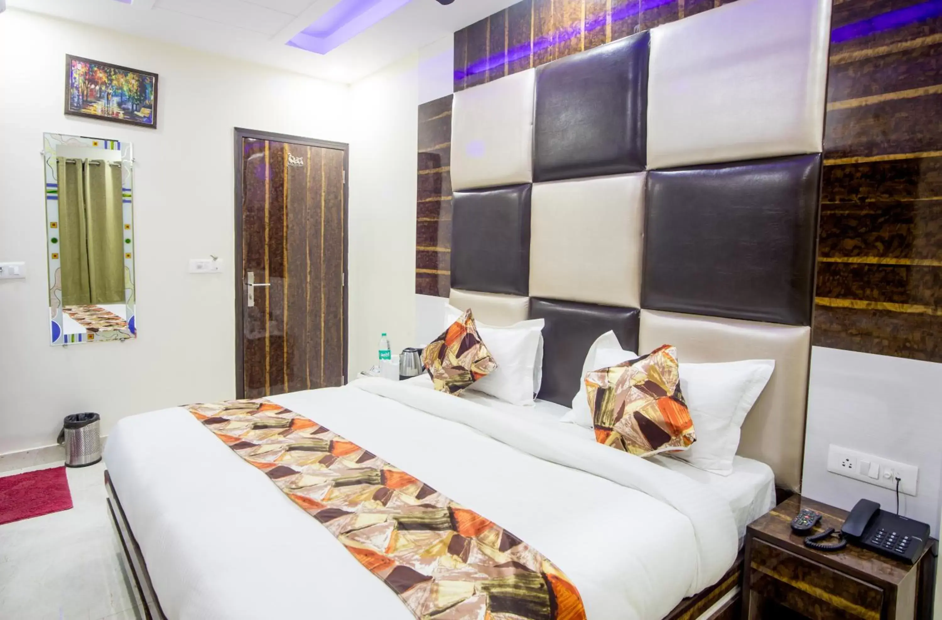 Bed in Hotel Harsha International