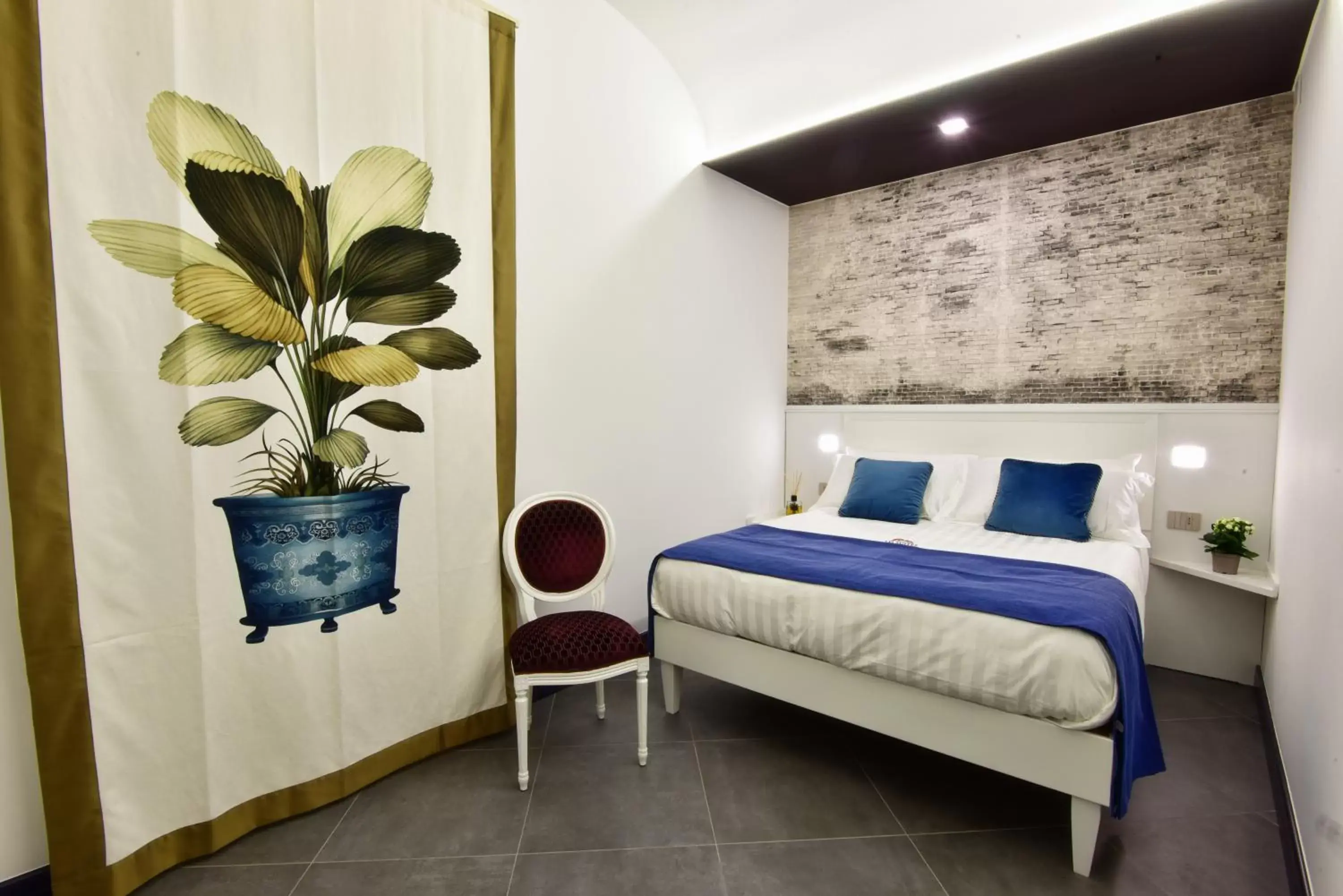 Bed in ANFITEATRO LE SUITES