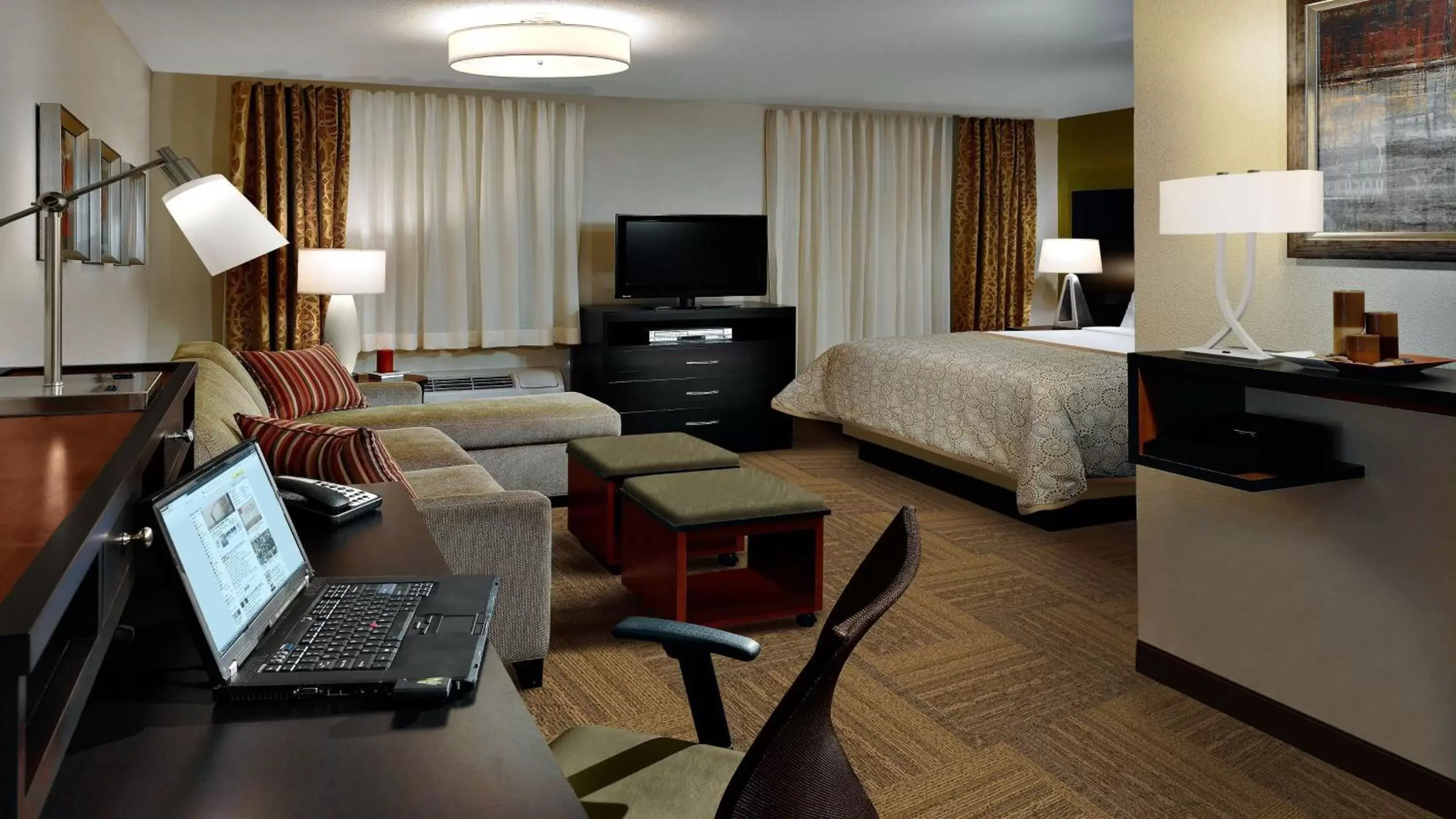 Photo of the whole room, TV/Entertainment Center in Staybridge Suites Dearborn, an IHG Hotel