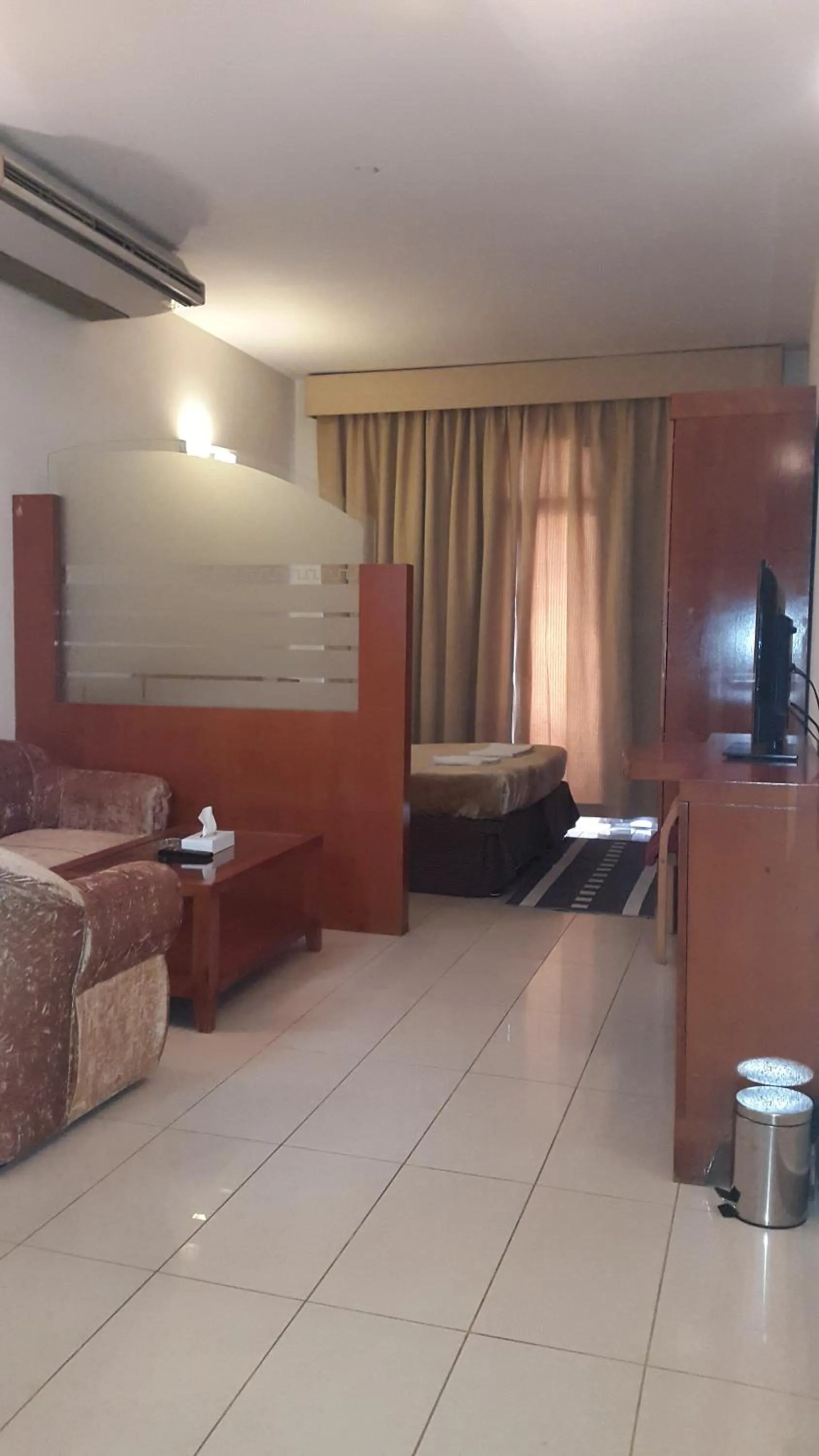 Photo of the whole room, TV/Entertainment Center in AL Raien Hotel Apartment