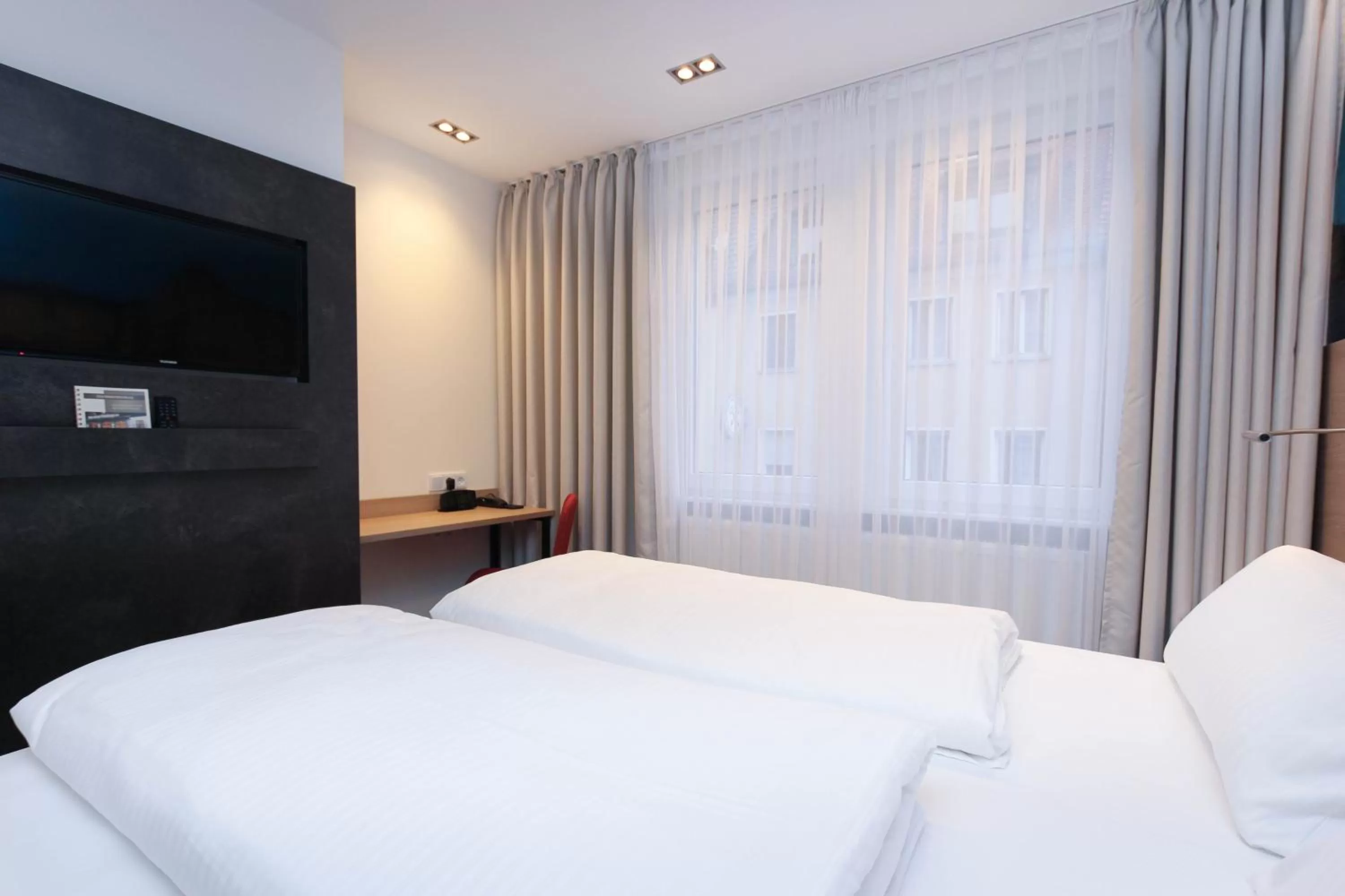 Bed in City Hotel Würzburg