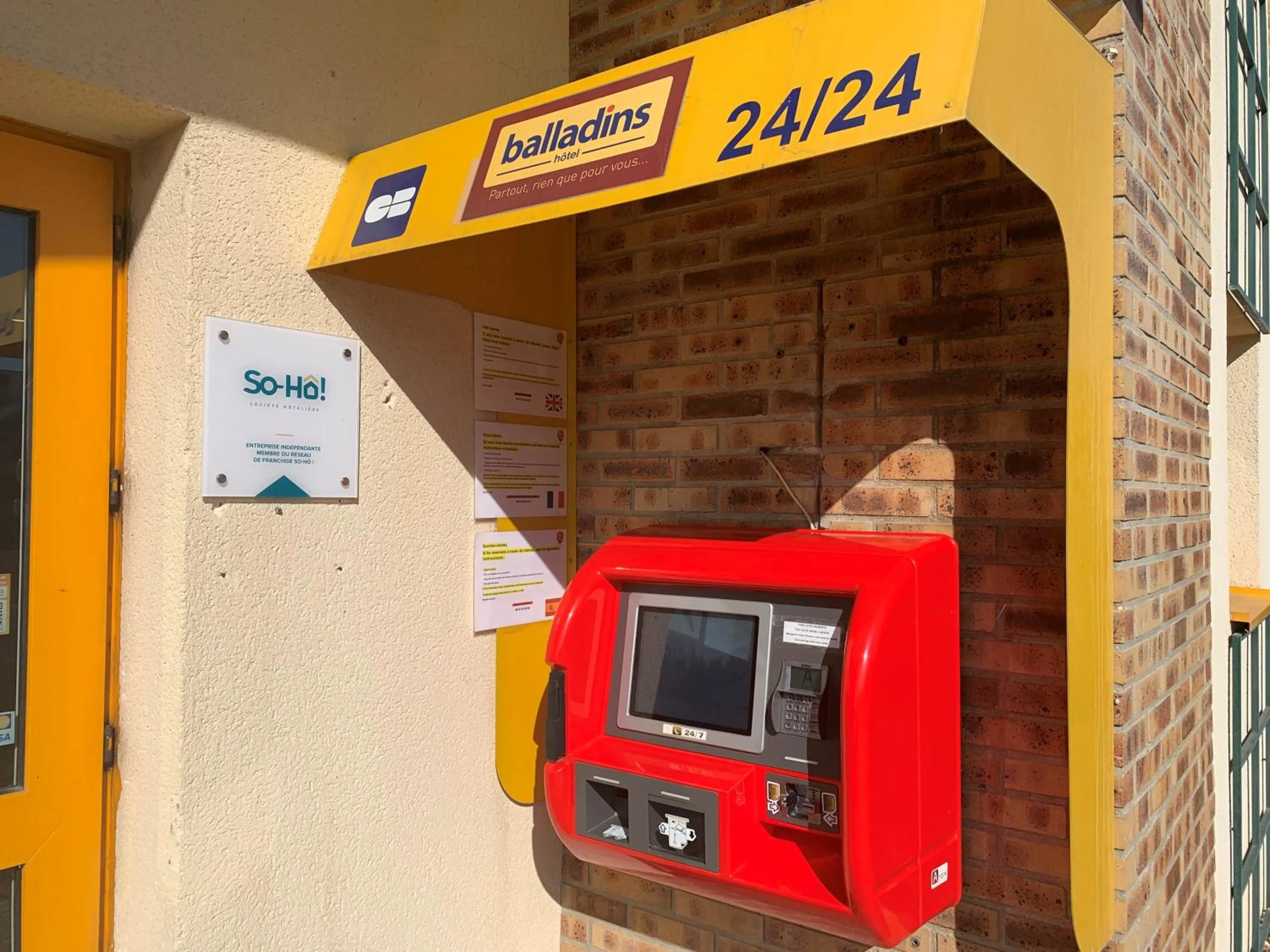 Lobby or reception in initial by balladins Tours Sud