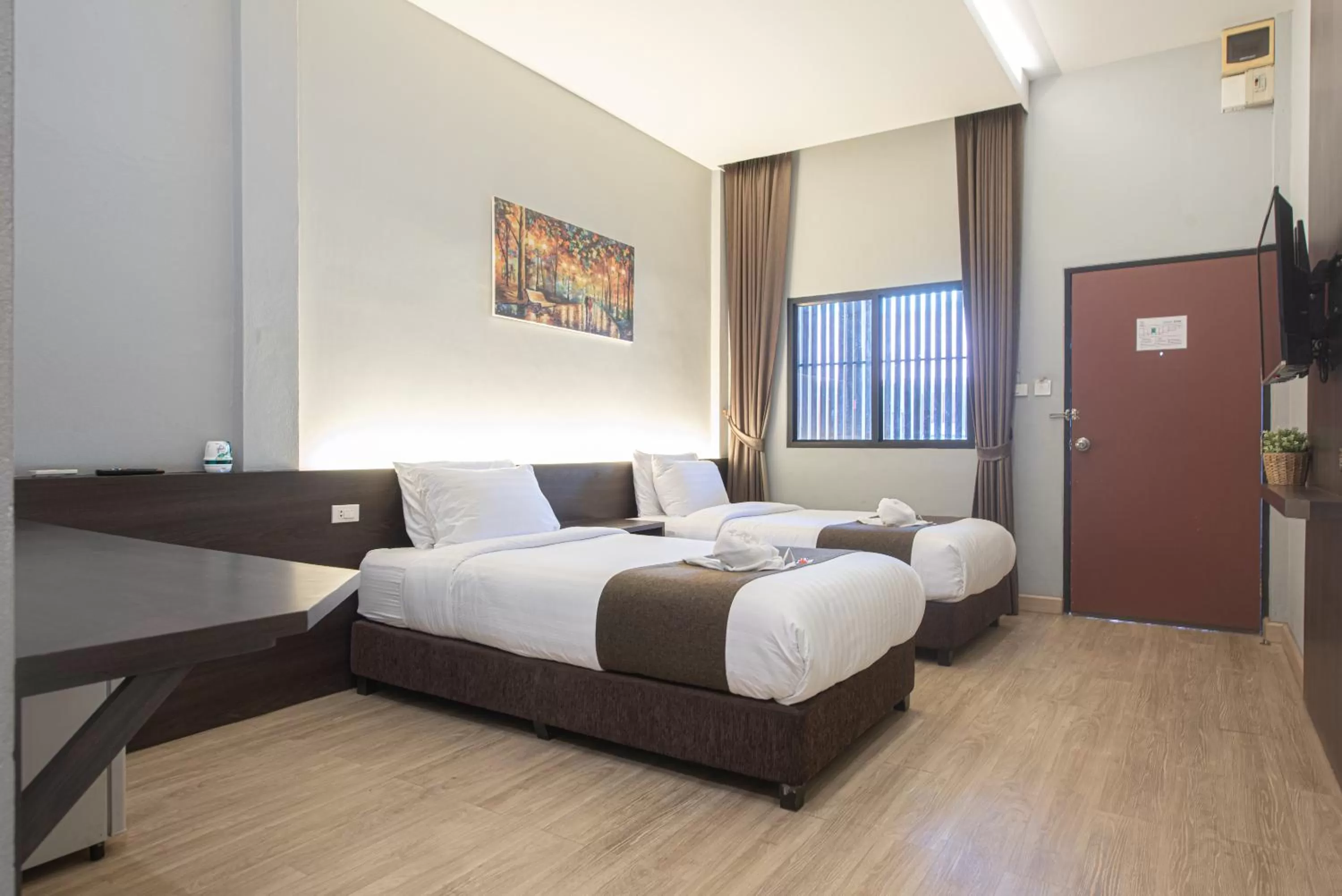 Bed in Tarnsiri Boutique Resort