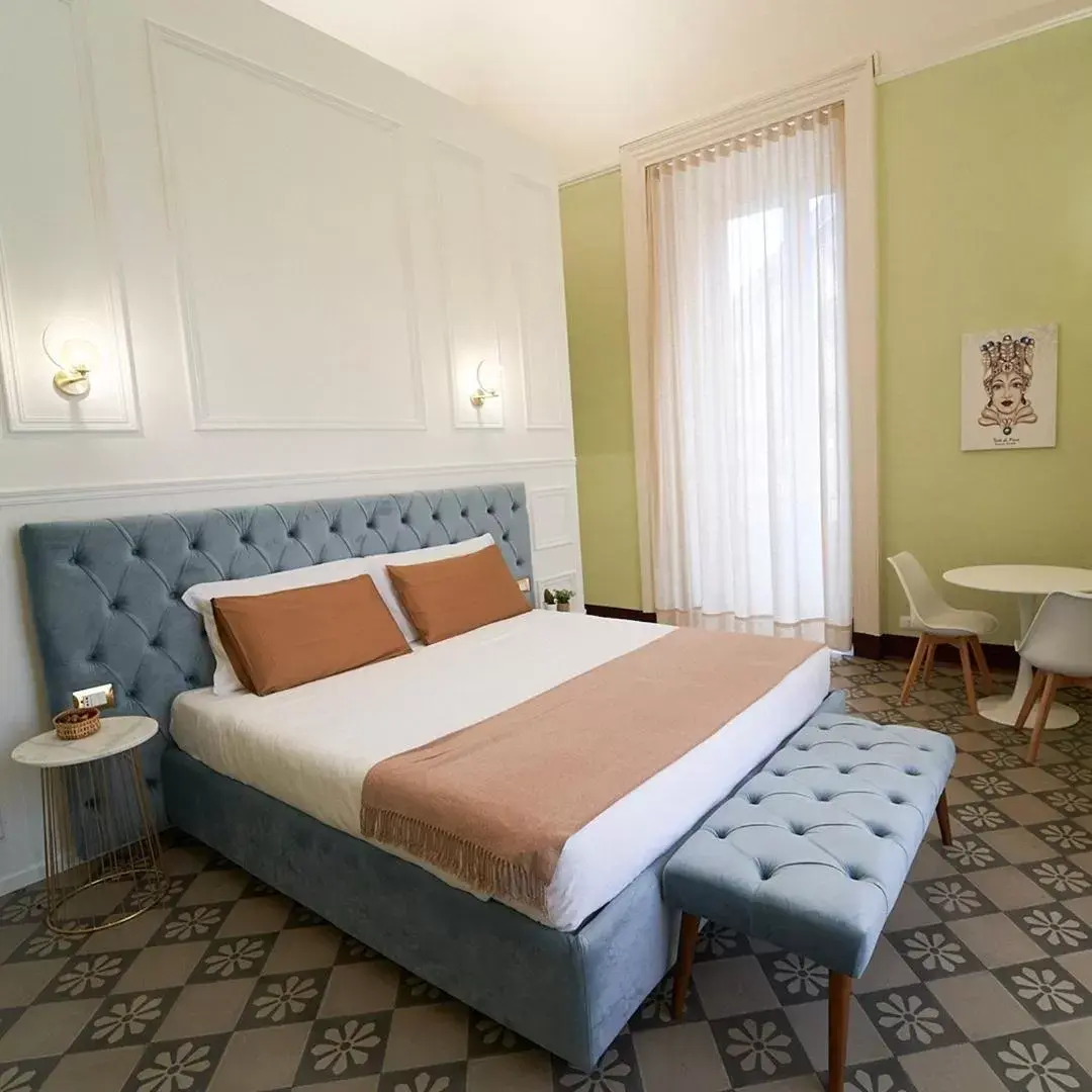 Bed in Toscano Palace Luxury Rooms Catania