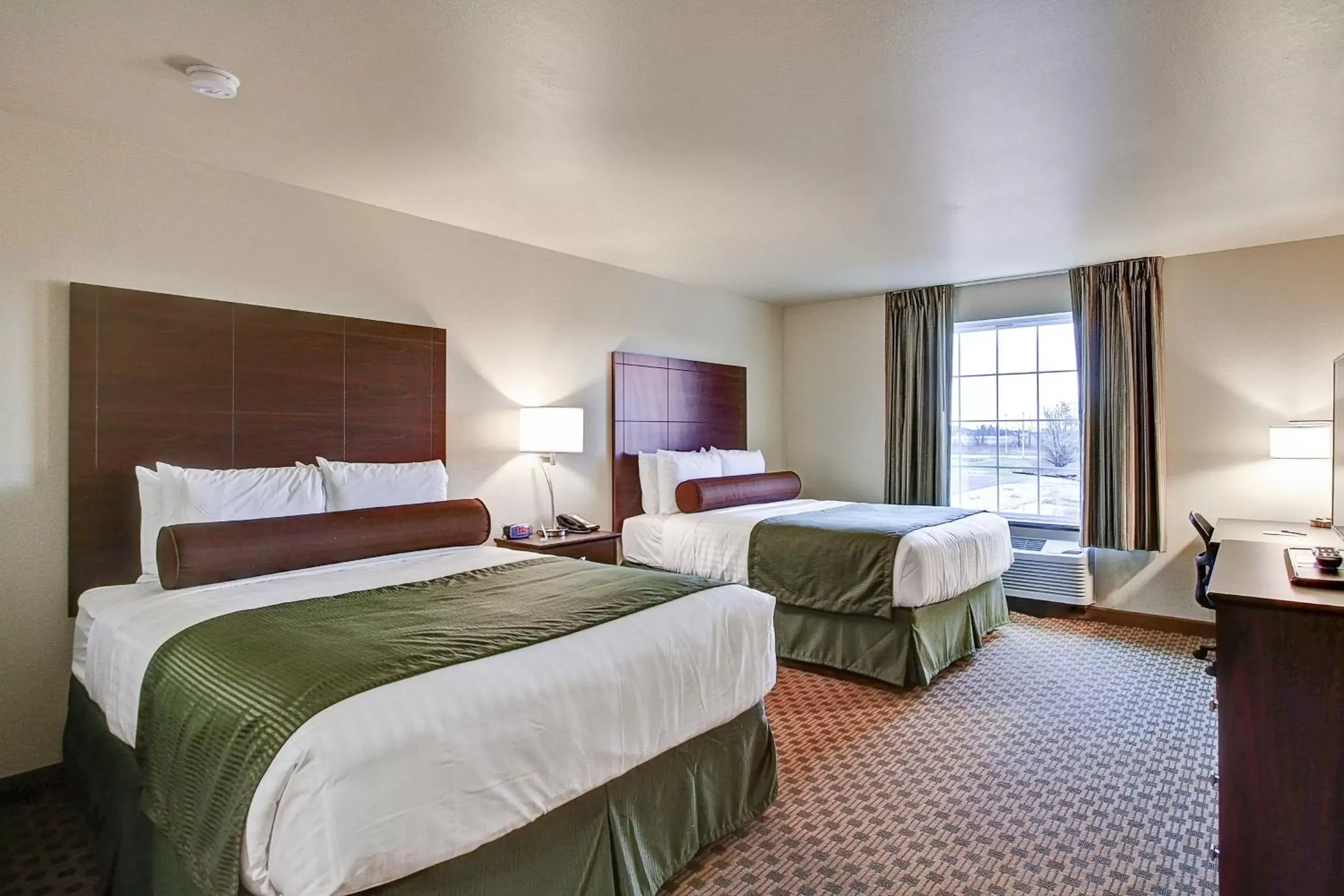 Bed in Cobblestone Hotel & Suites Pulaski/Green Bay