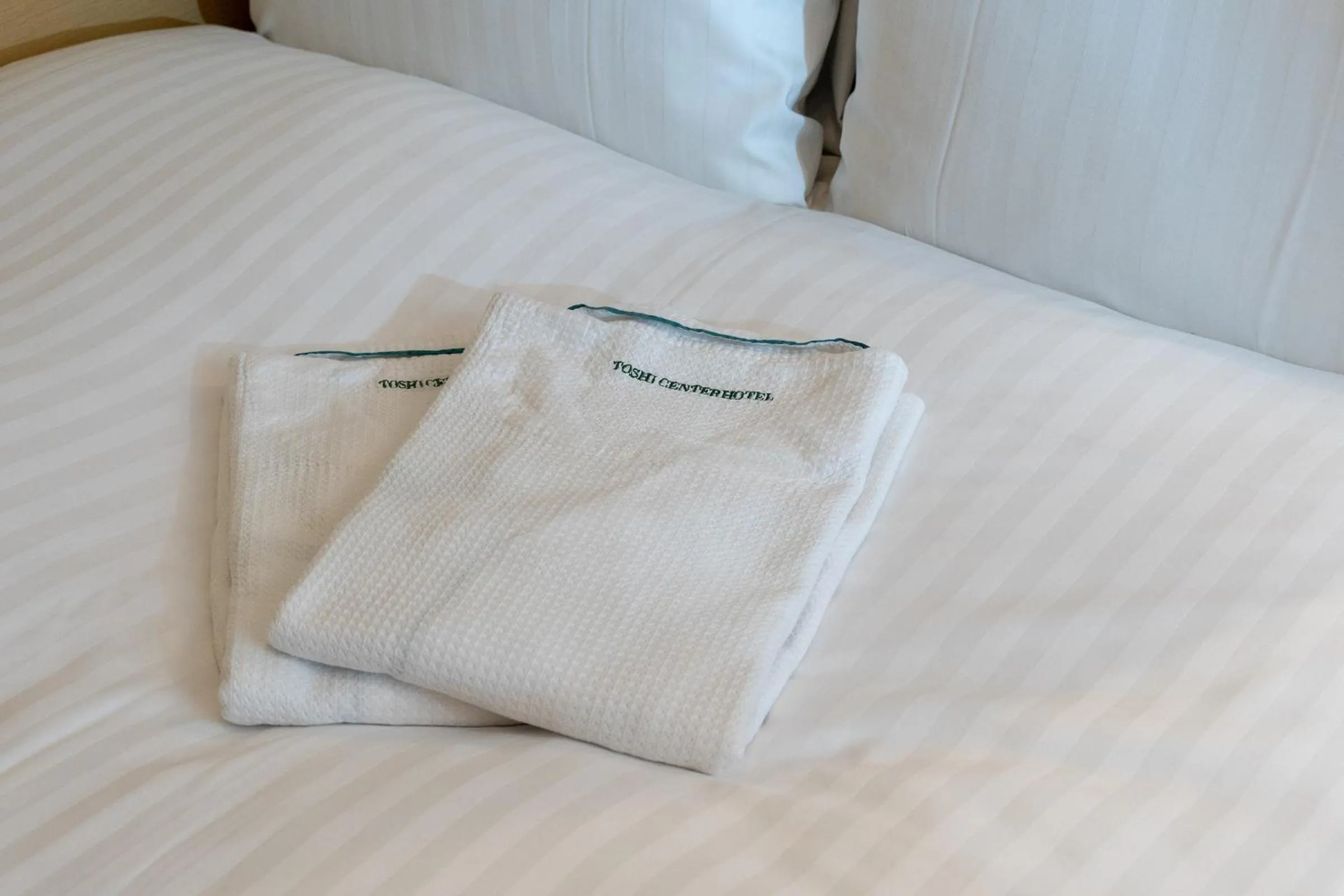 Bedroom, Bed in Toshi Center Hotel